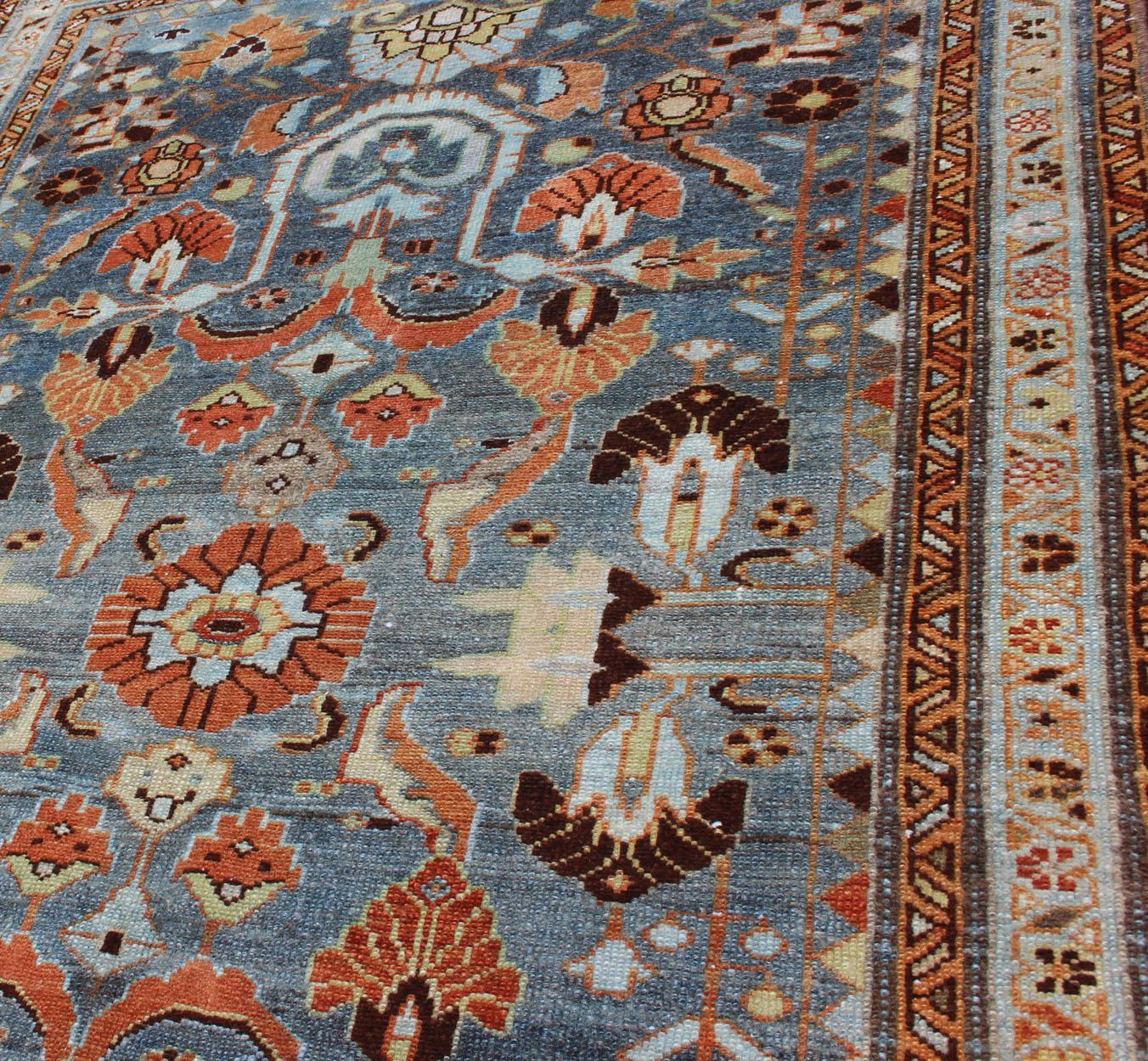 Wool Antique Persian Malayer Rug with a Blue Field and Stylized Floral Design For Sale