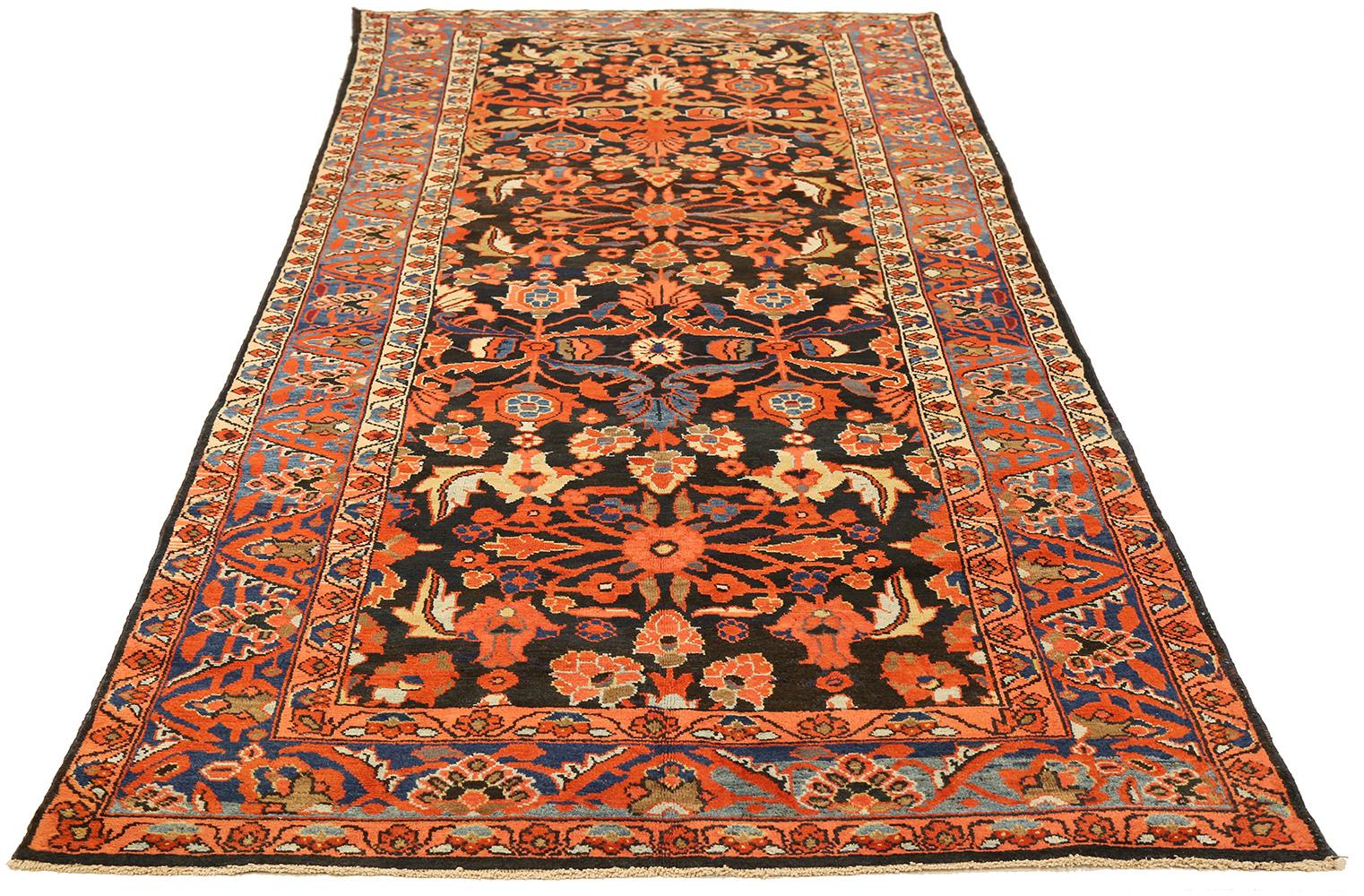 Antique Persian rug handwoven from the finest sheep’s wool and colored with all-natural vegetable dyes that are safe for humans and pets. It’s a traditional Malayer design featuring a colorful mix of floral details on an ivory field. It’s a lovely