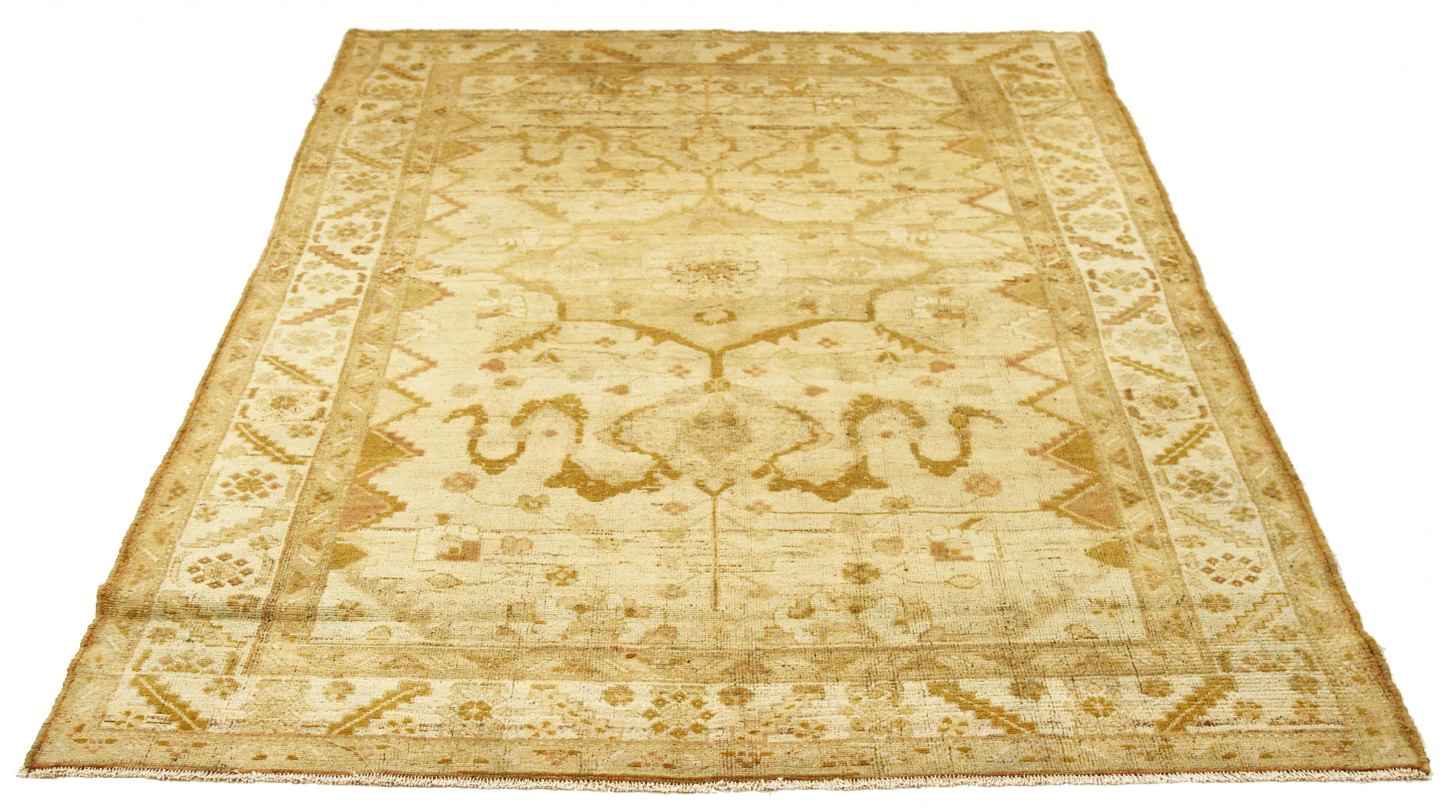 Antique Persian rug handwoven from the finest sheep’s wool and colored with all-natural vegetable dyes that are safe for humans and pets. It’s a traditional Malayer design featuring brown botanical details over an ivory field. It’s a lovely piece to