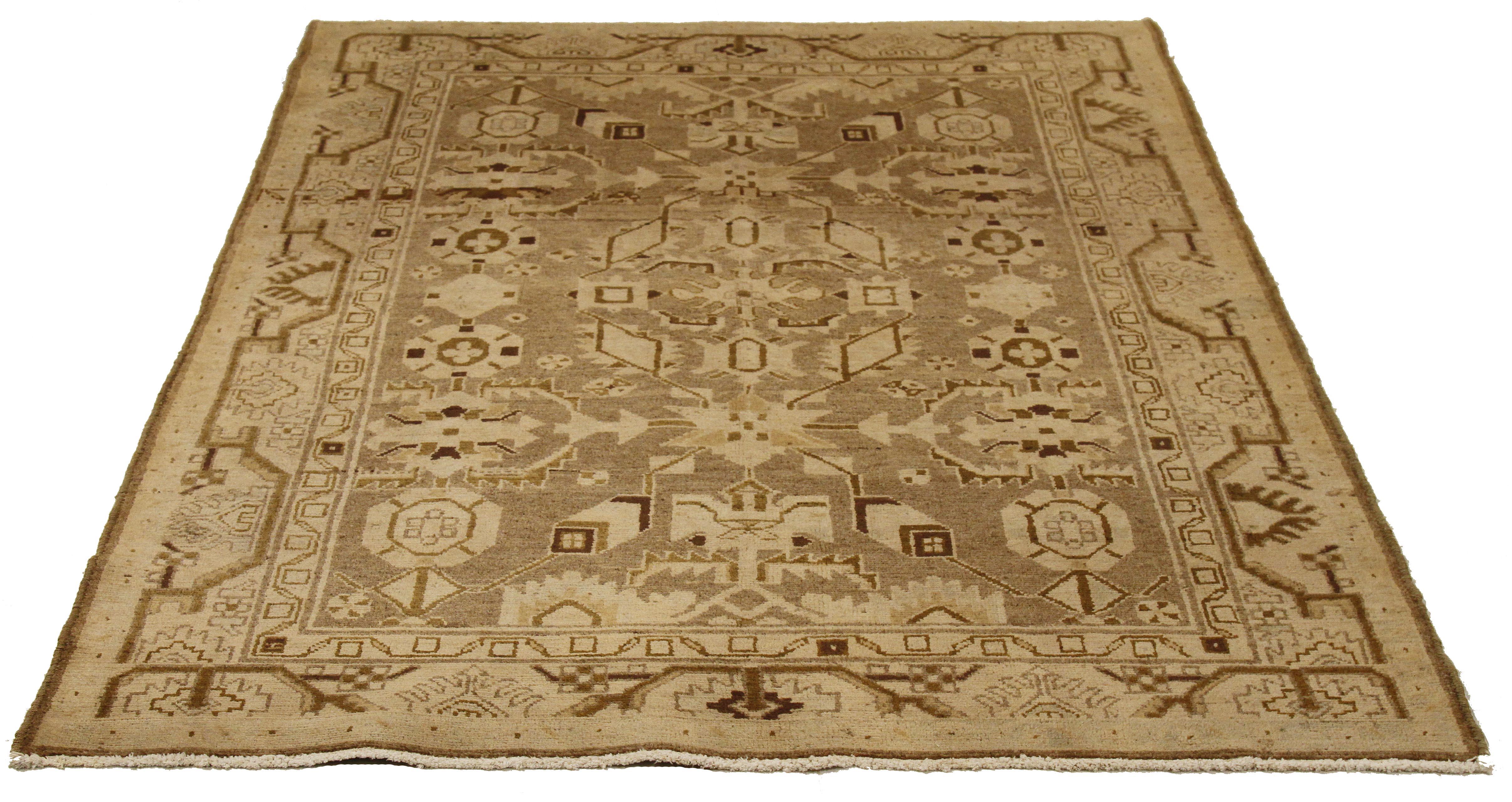 Antique Persian runner rug handwoven from the finest sheep’s wool and colored with all-natural vegetable dyes that are safe for humans and pets. It’s a traditional Malayer design featuring brown and beige tribal details over an ivory field. It’s a