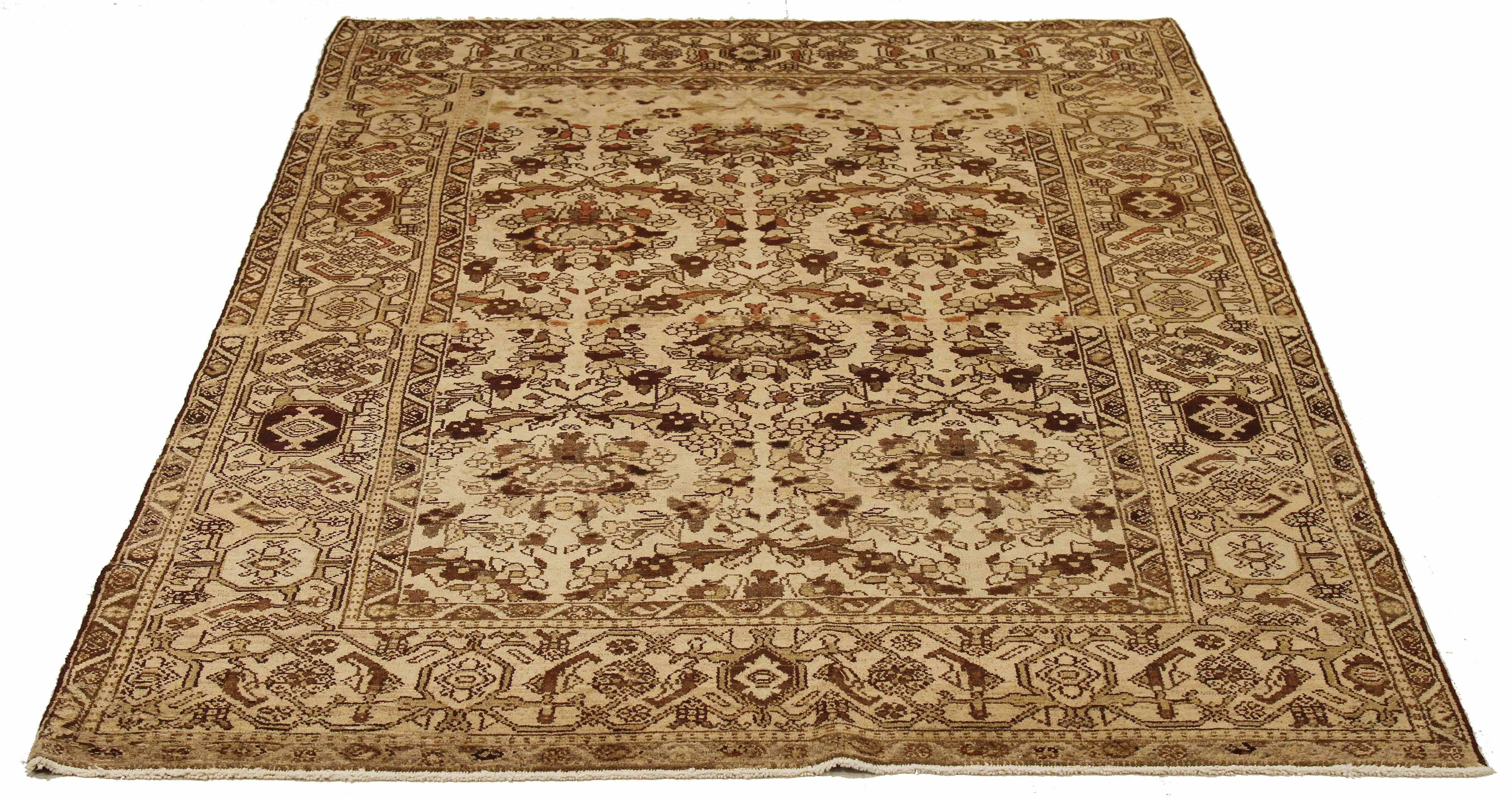 Antique Persian runner rug handwoven from the finest sheep’s wool and colored with all-natural vegetable dyes that are safe for humans and pets. It’s a traditional Malayer design featuring brown and black botanical details over a beige field. It’s a
