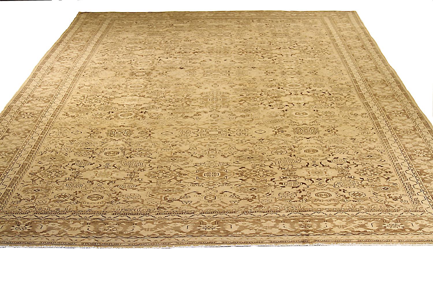 Antique Persian rug handwoven from the finest sheep’s wool and colored with all-natural vegetable dyes that are safe for humans and pets. It’s a traditional Malayer design featuring brown and black floral details on an ivory field. It’s a lovely