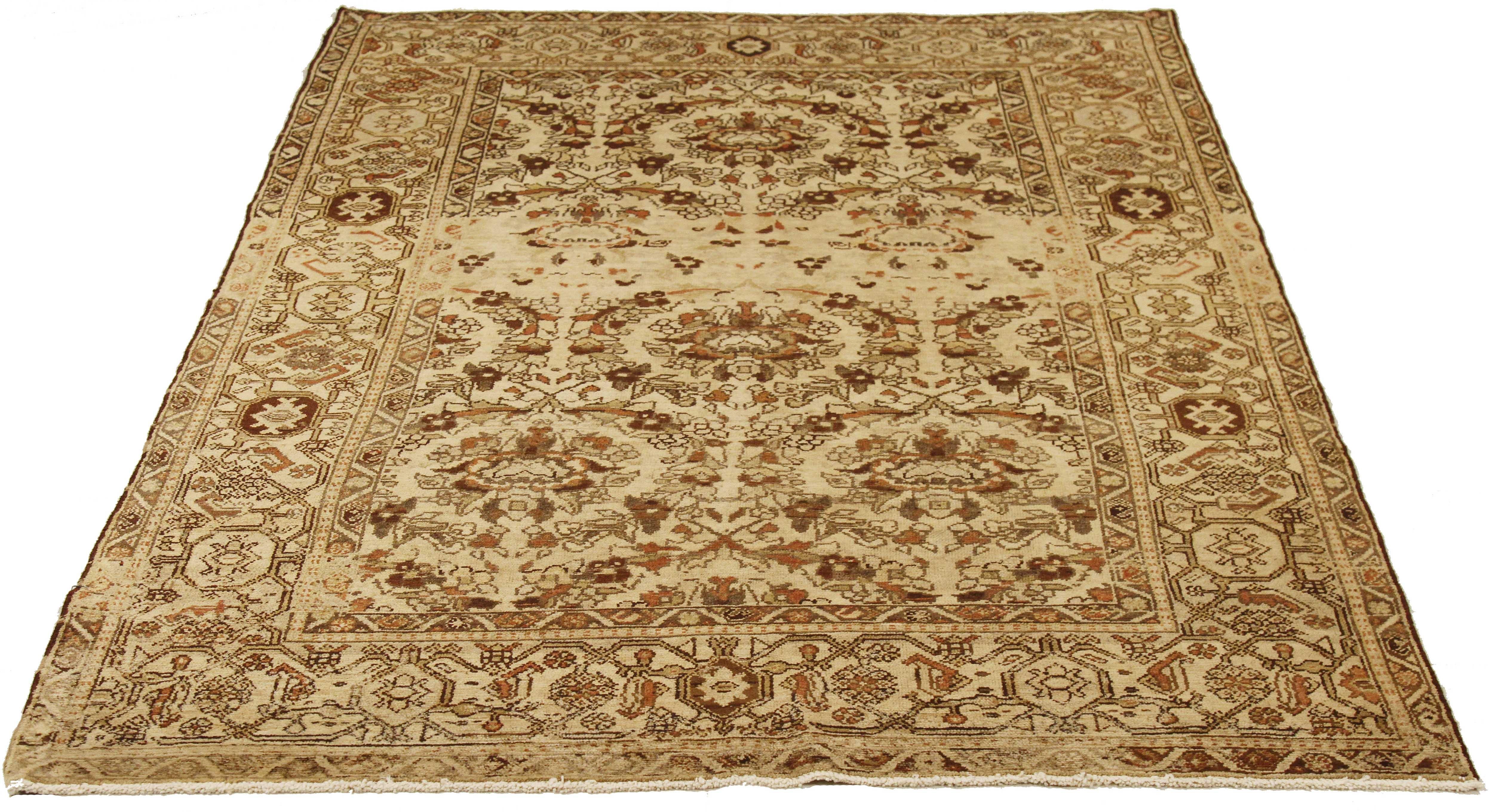Antique Persian runner rug handwoven from the finest sheep’s wool and colored with all-natural vegetable dyes that are safe for humans and pets. It’s a traditional Malayer design featuring brown and black floral details over an ivory field. It’s a
