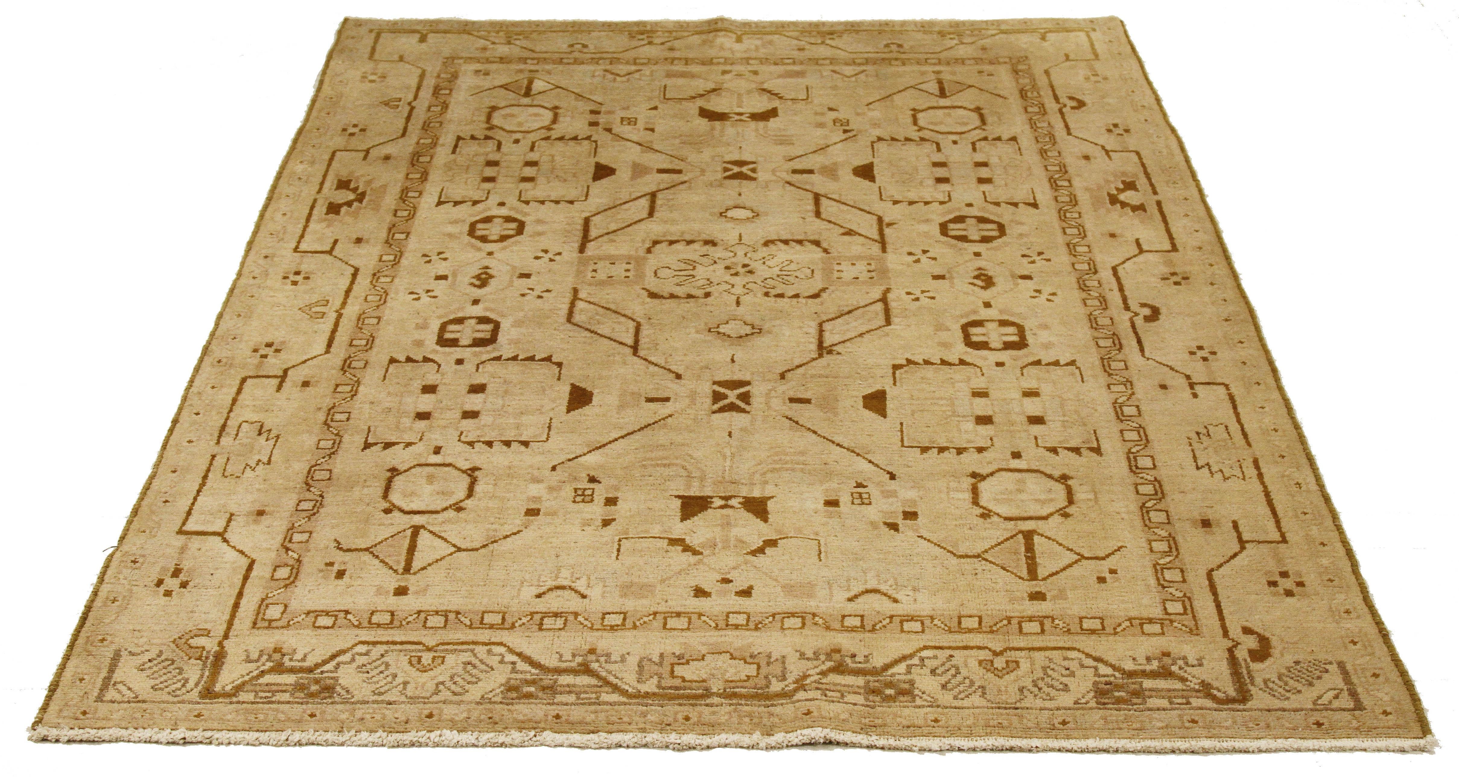 Antique Persian runner rug handwoven from the finest sheep’s wool and colored with all-natural vegetable dyes that are safe for humans and pets. It’s a traditional Malayer design featuring brown geometric and tribal details over an ivory field. It’s