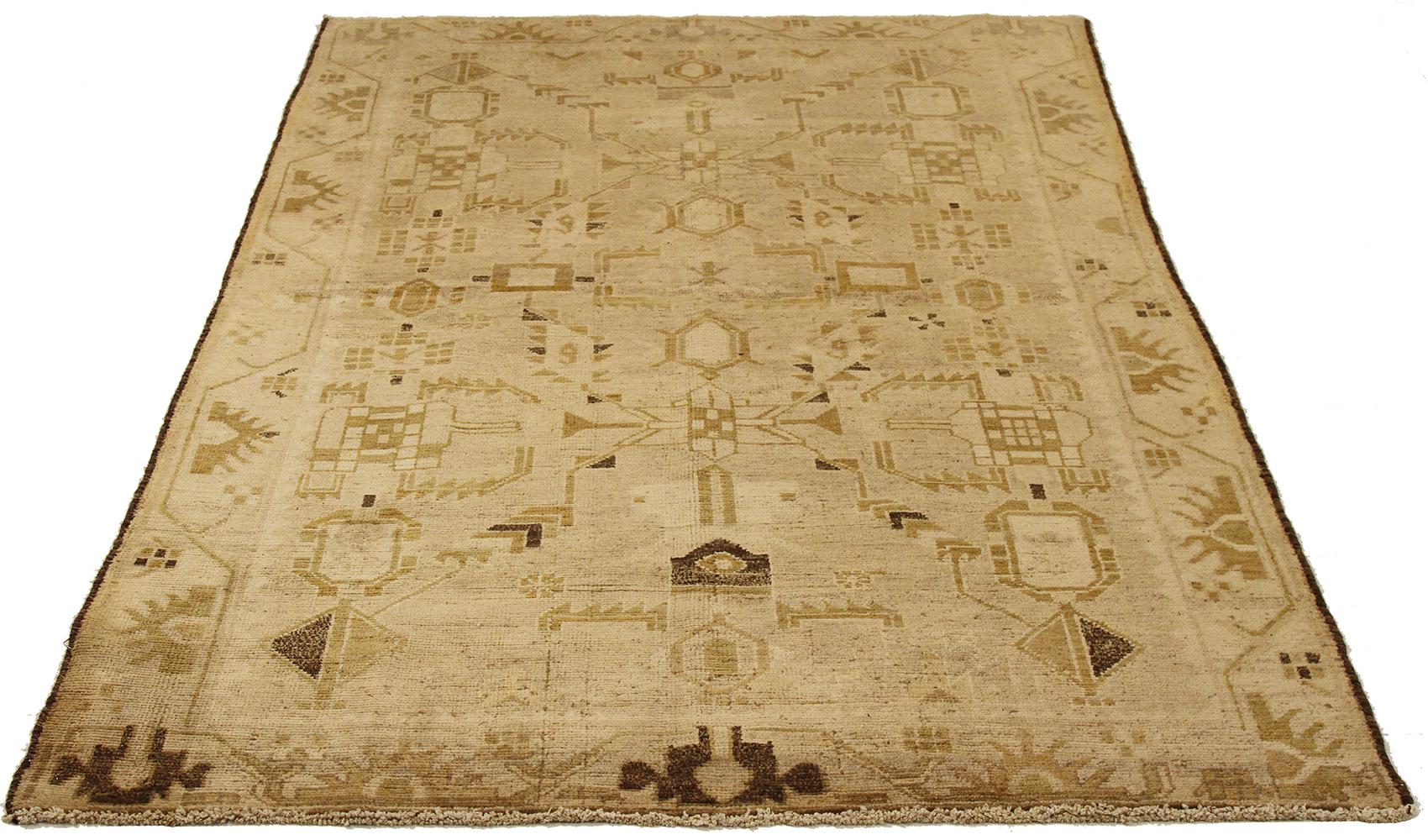 Antique Persian runner rug handwoven from the finest sheep’s wool and colored with all-natural vegetable dyes that are safe for humans and pets. It’s a traditional Malayer design featuring brown and gold geometric details over an ivory field. It’s a