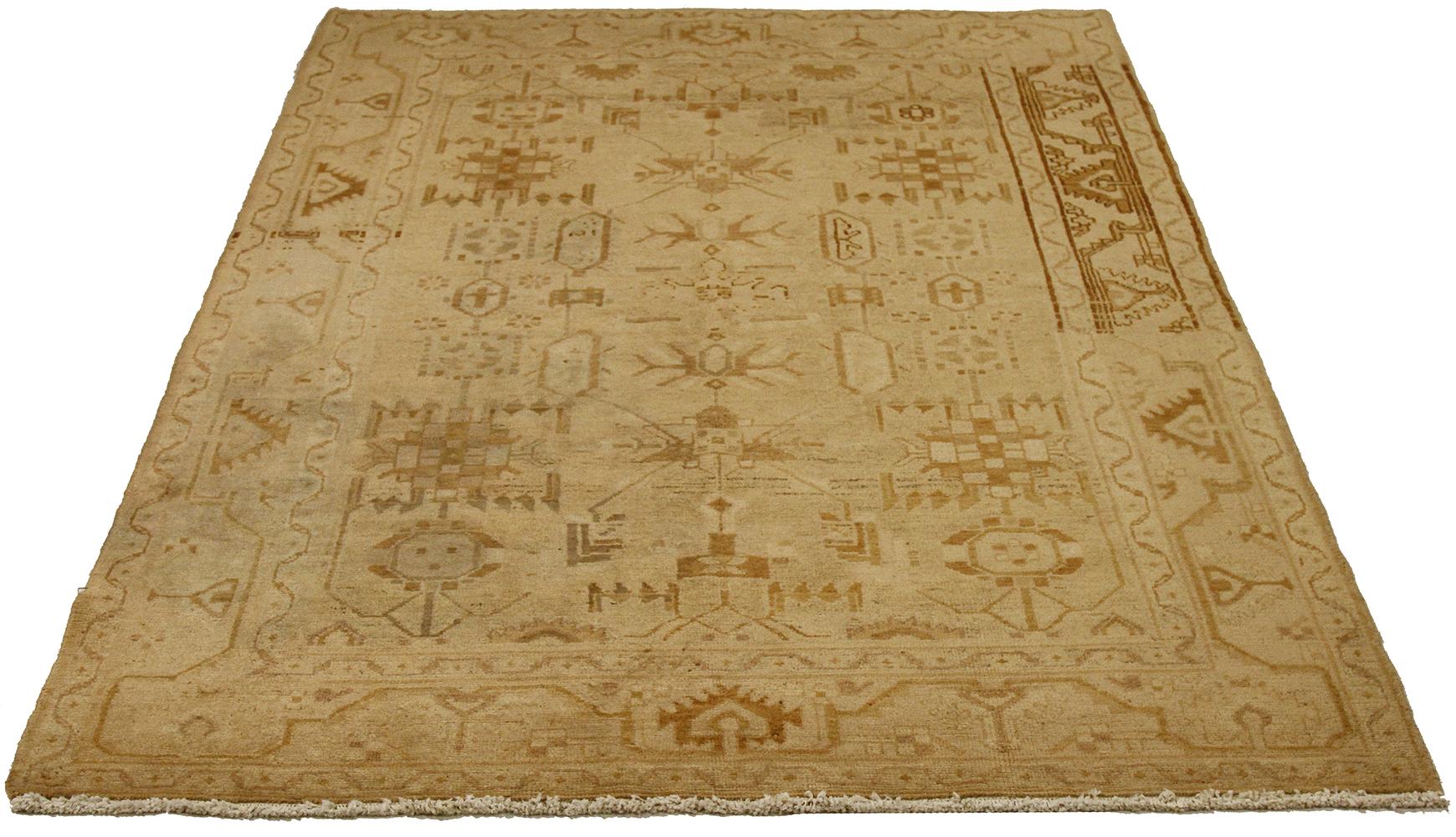 Antique Persian runner rug handwoven from the finest sheep’s wool and colored with all-natural vegetable dyes that are safe for humans and pets. It’s a traditional Malayer design featuring faded beige and brown tribal details over an ivory field.