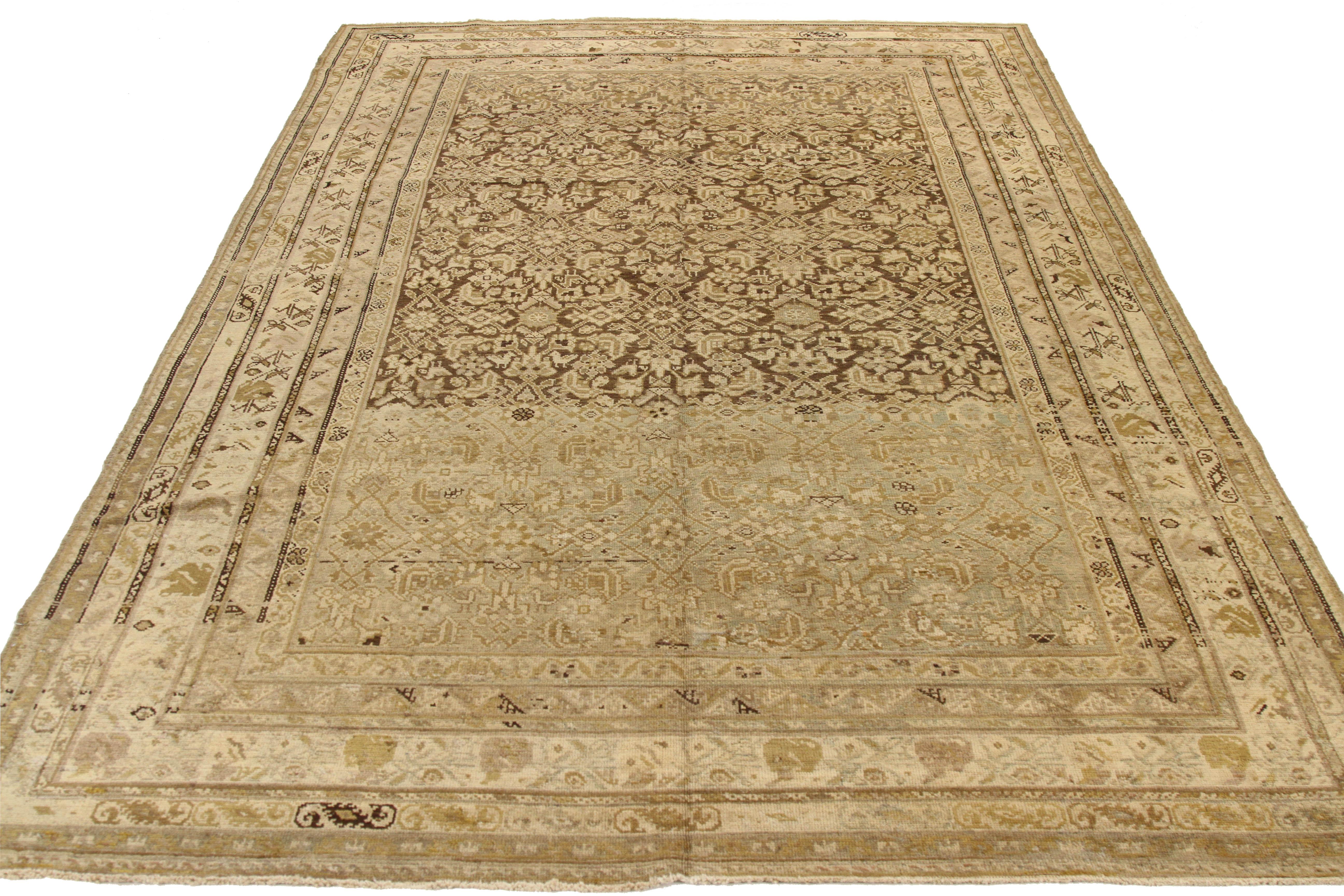 Antique Persian rug handwoven from the finest sheep’s wool and colored with all-natural vegetable dyes that are safe for humans and pets. It’s a traditional Malayer design featuring floral patterns on an ivory field. It’s a lovely piece to showcase