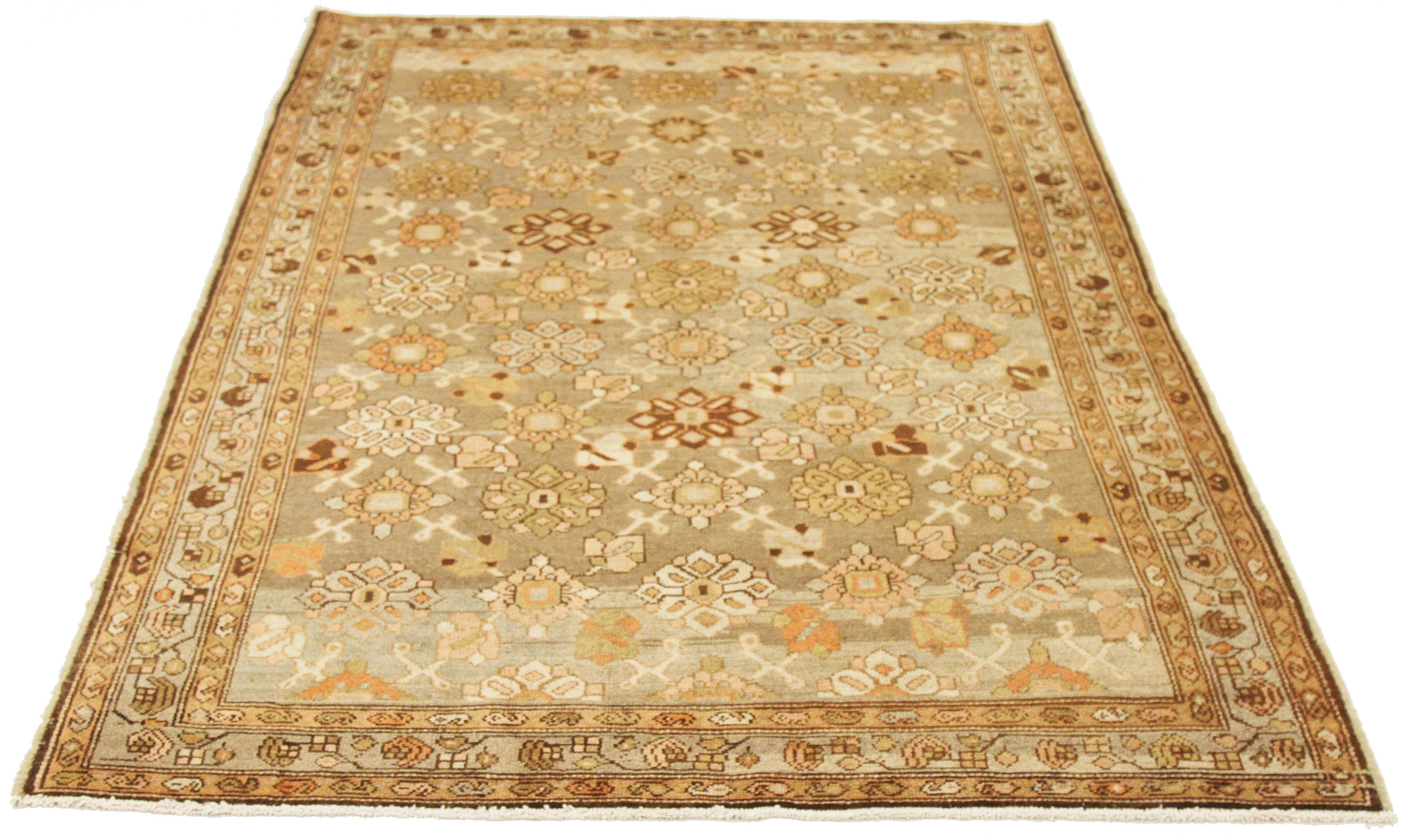 Antique Persian rug handwoven from the finest sheep’s wool and colored with all-natural vegetable dyes that are safe for humans and pets. It’s a traditional Malayer design featuring colored flower heads details all-over the ivory and gray field.