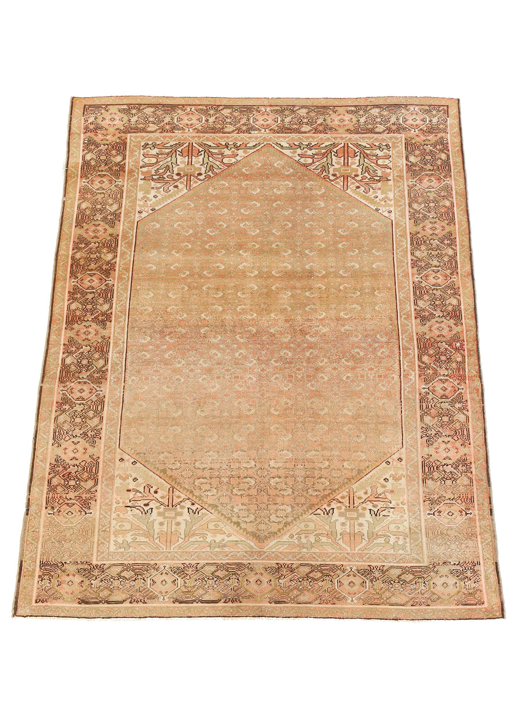 Antique Persian rug handwoven from the finest sheep’s wool and colored with all-natural vegetable dyes that are safe for humans and pets. It’s a traditional Malayer design featuring green and pink botanical details on an ivory field. It’s a lovely