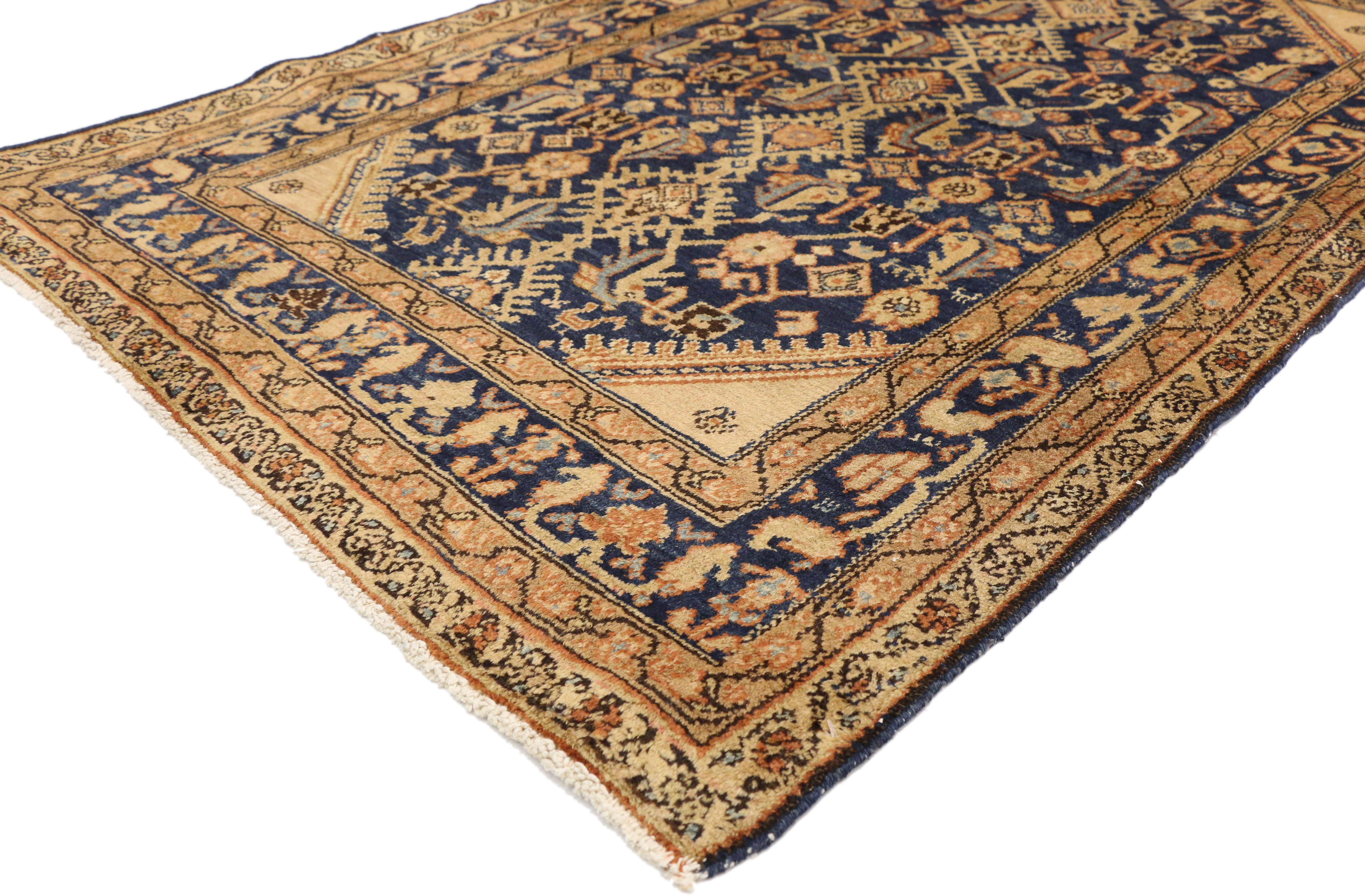 73998 antique Persian Malayer rug with Hollywood Regency style. This hand knotted wool antique Persian Malayer rug features an all-over Herati pattern spread across an abrashed navy blue field. The classic Herati pattern, also known as the Mahi or