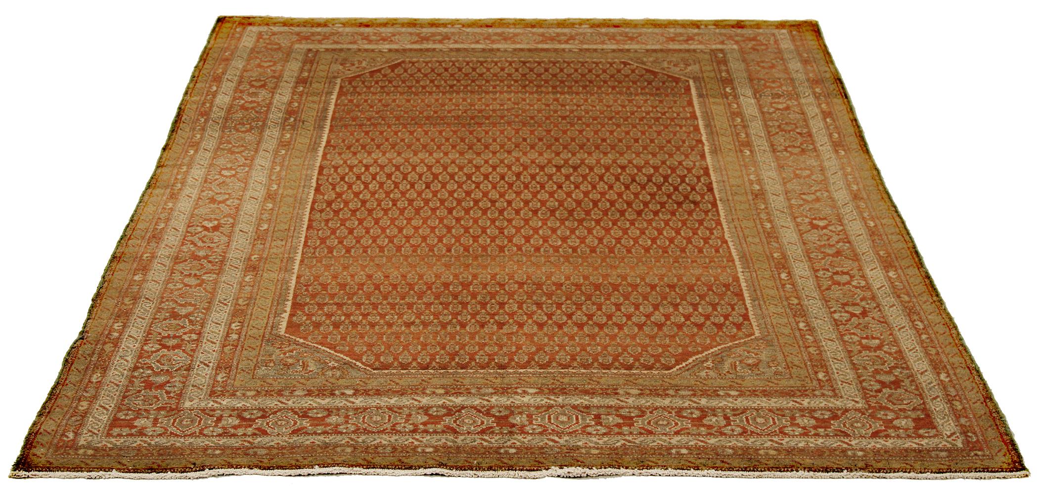 Antique Persian runner rug handwoven from the finest sheep’s wool and colored with all-natural vegetable dyes that are safe for humans and pets. It’s a traditional Malayer design featuring ivory and beige ‘Boteh’ details over a rich red field. It’s