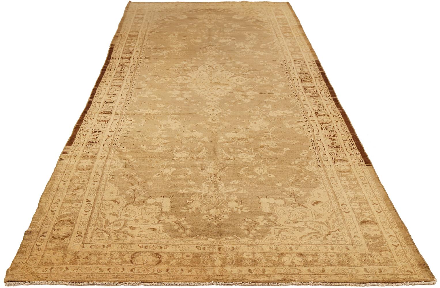 Antique Persian rug handwoven from the finest sheep’s wool and colored with all-natural vegetable dyes that are safe for humans and pets. It’s a traditional Malayer design featuring ivory and brown botanical details on mixed ivory and beige field.