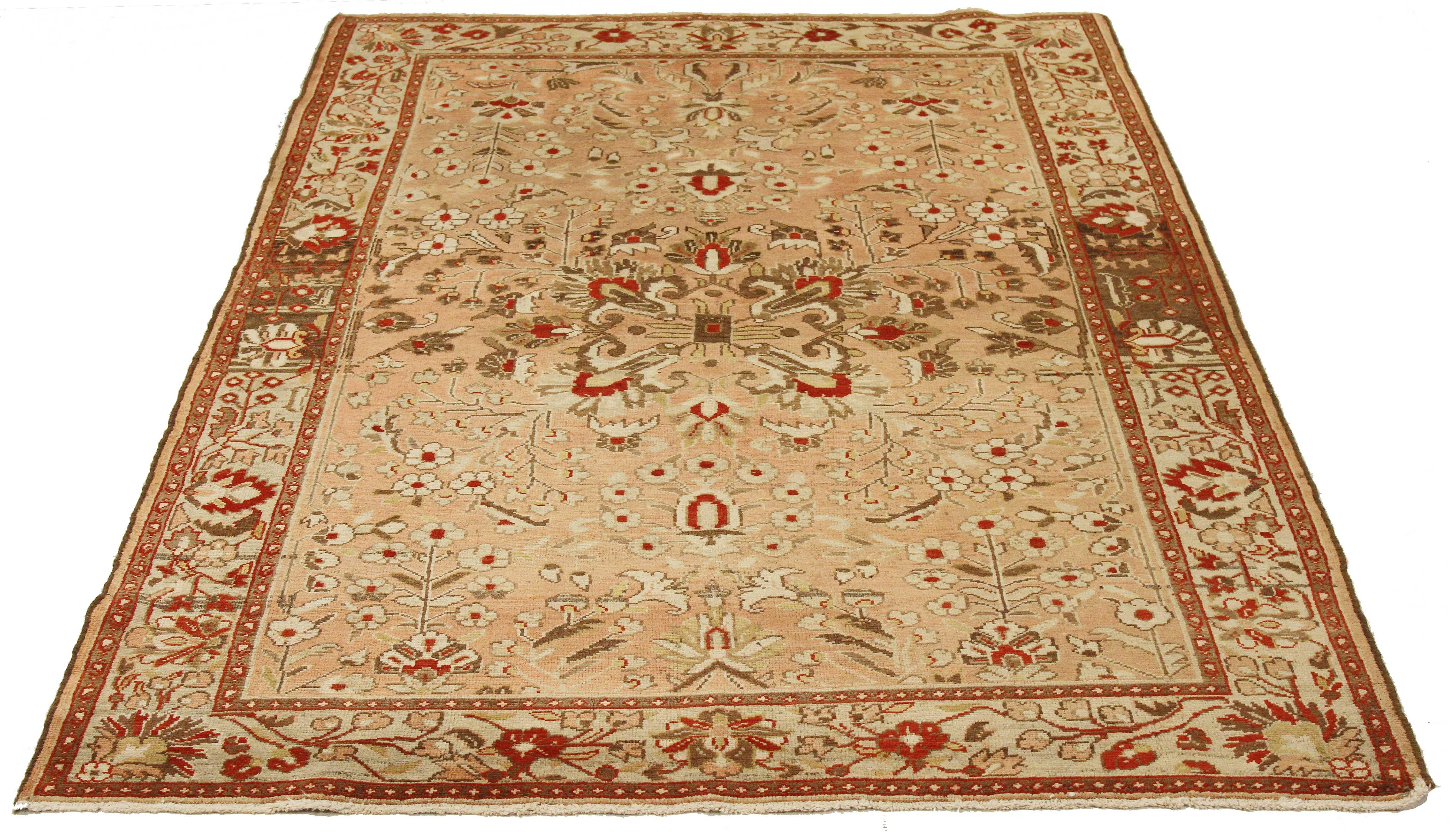 Antique Persian runner rug handwoven from the finest sheep’s wool and colored with all-natural vegetable dyes that are safe for humans and pets. It’s a traditional Malayer design featuring ivory, brown and green floral and geometric details over a