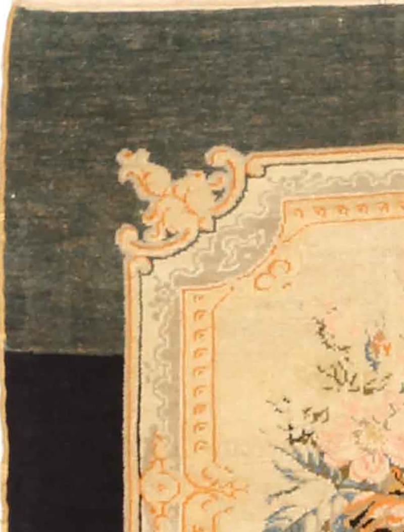 Antique Persian runner rug handwoven from the finest sheep’s wool and colored with all-natural vegetable dyes that are safe for humans and pets. It’s a traditional Malayer design featuring a floral bouquet design in orange, pink and gray over an
