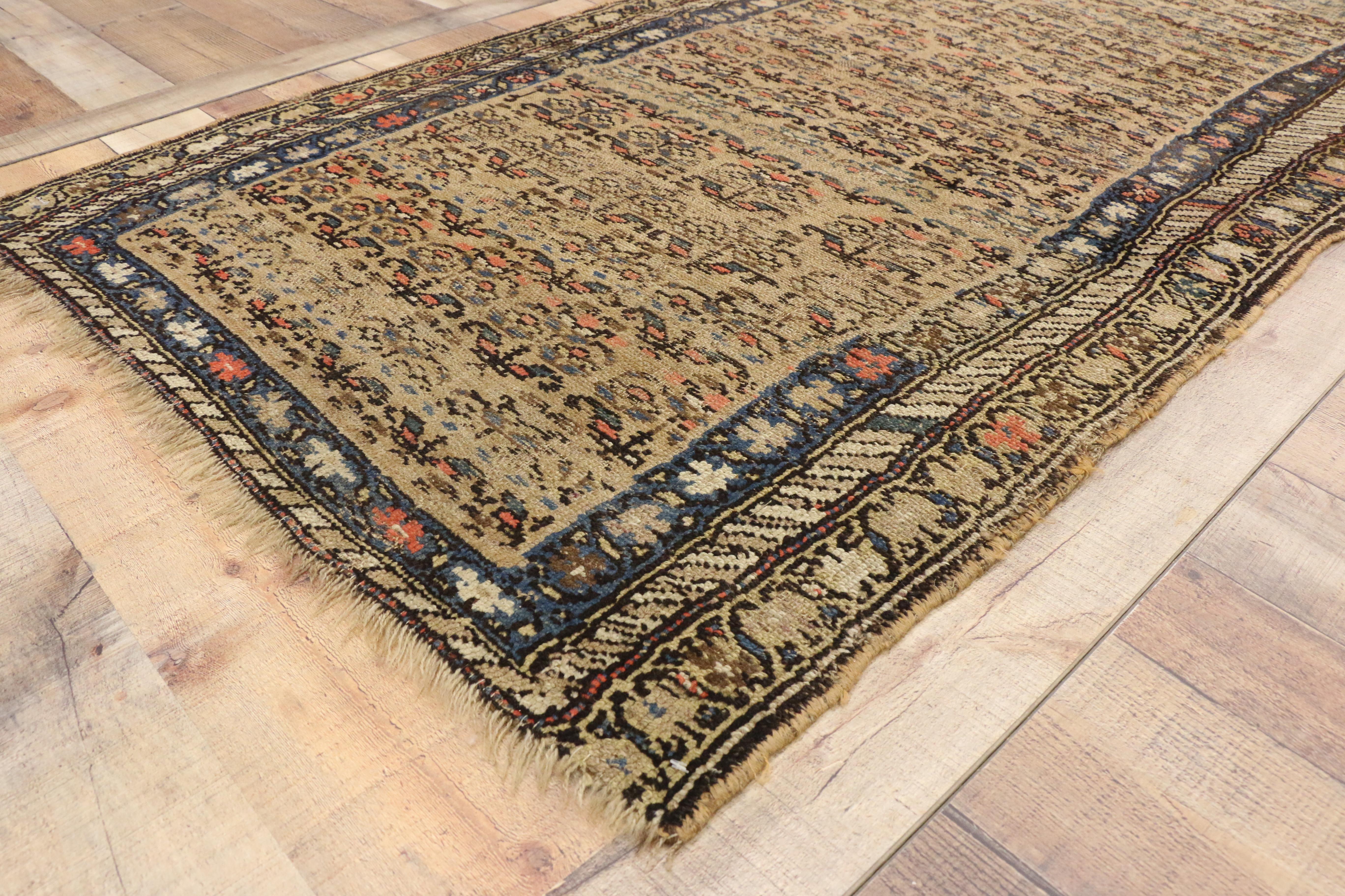 71582, distressed antique Persian Malayer rug with rustic Farmhouse style. This hand-knotted wool distressed antique Persian Malayer rug features an all-over floral lattice pattern overlaid across an abrashed field. The offset rows of stylized
