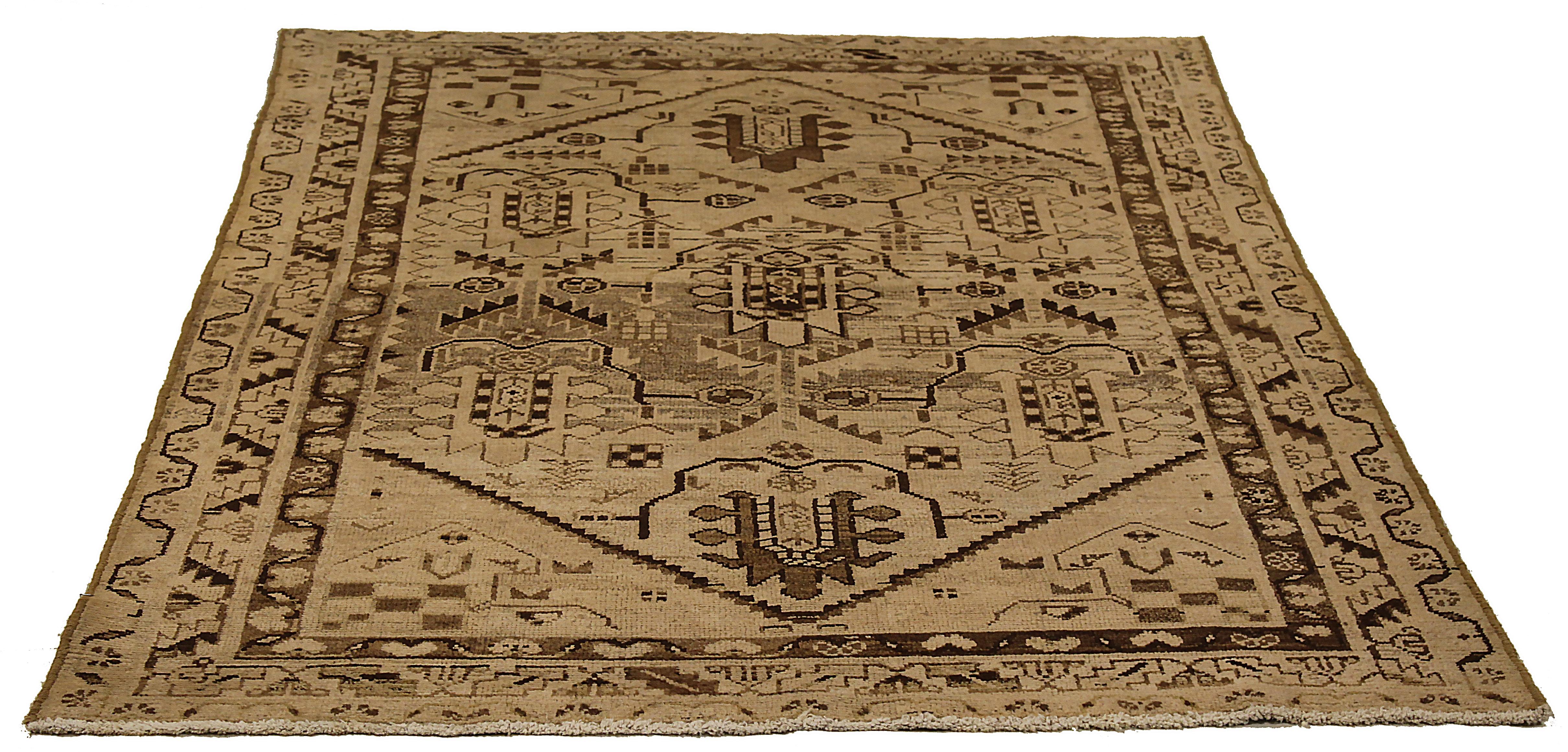 Antique Persian rug handwoven from the finest sheep’s wool. It’s colored with all-natural vegetable dyes that are safe for humans and pets. It’s a traditional Malayer design featuring floral details on an ivory field. It’s a lovely piece to showcase
