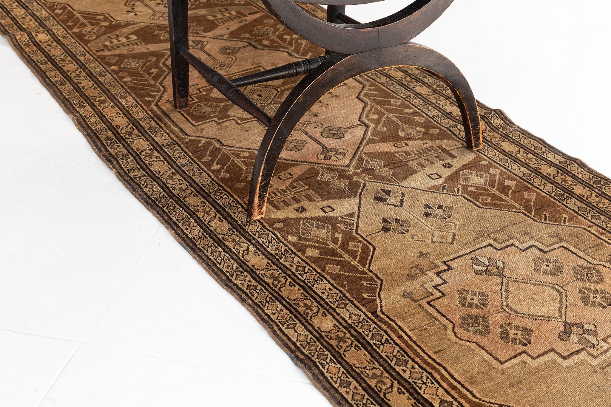 This runner contains neutral brown and beige colored tones along with geometric tribal patterns. Three thin borders outline the center and helps give this piece some character.

Rug Number
12695
Size
2' 11
