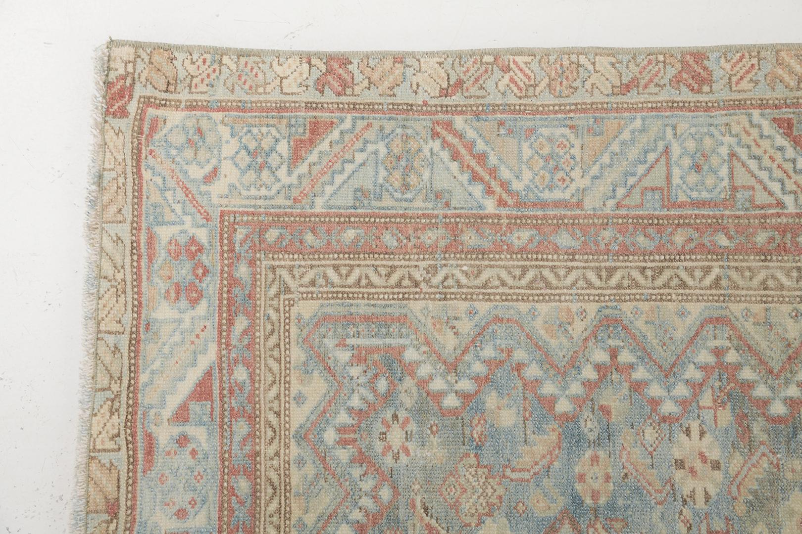 An exquisitely composed antique Persian Malayer runner that is a captivating illustration of high aesthetic appeal, beguiling charm and alluring beauty. Herati patterns, serrated leaves and florid elements are showcasing undisputable elegance in the