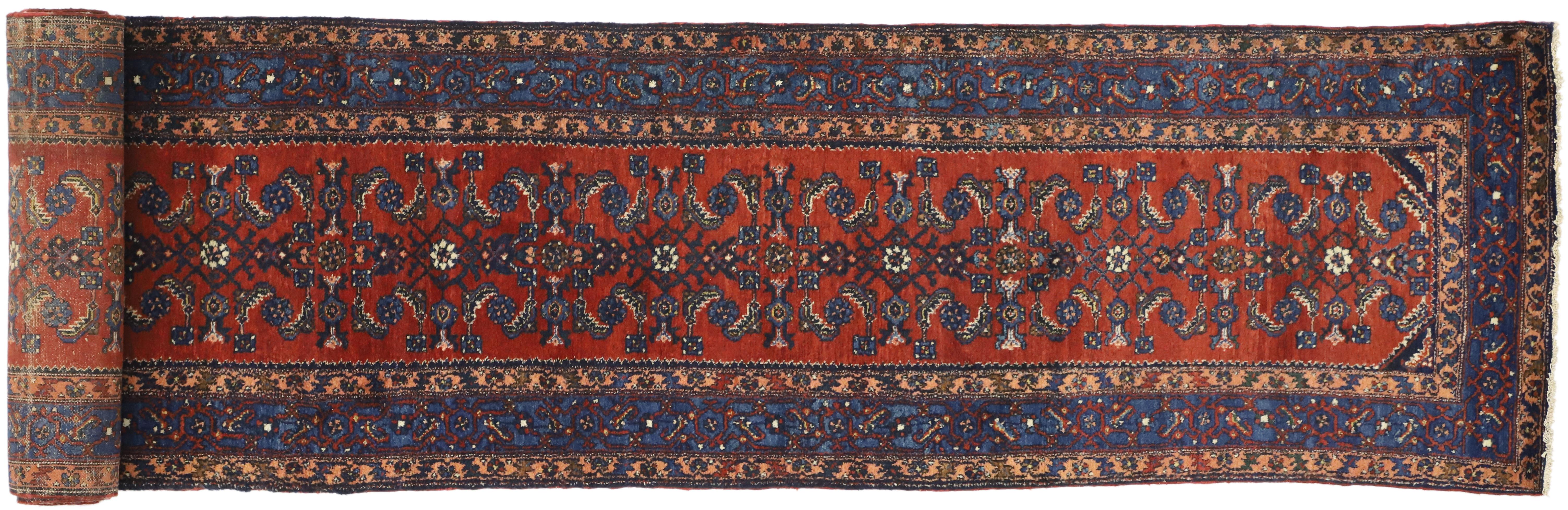 76875, Antique Persian Malayer Long Runner with Elizabeth Tudor Style, Extra Long Hallway Runner. This hand knotted wool antique Persian Malayer runner features an all-over Herati pattern across an abrashed scarlet red field. A complementary Herati