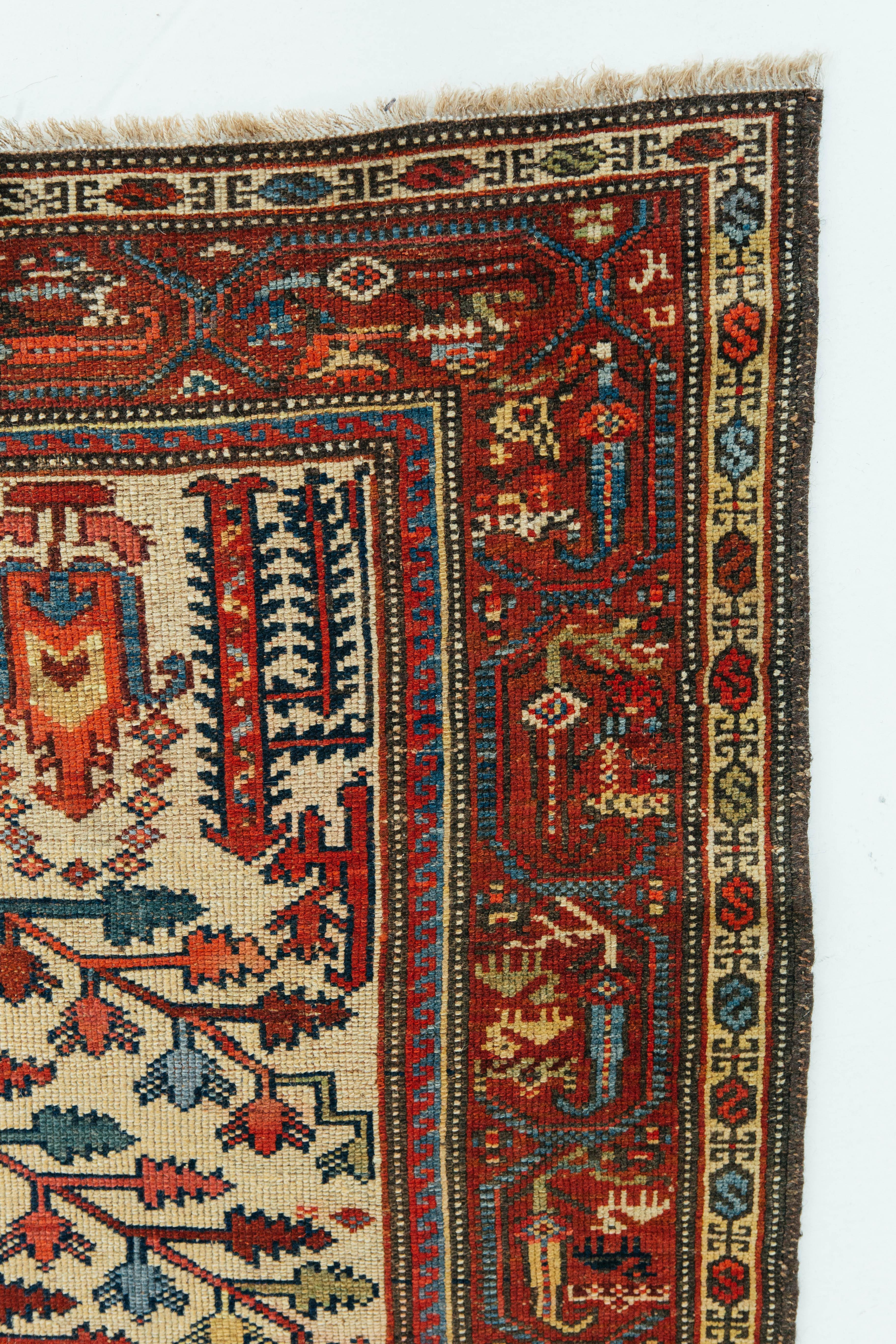 An authentic Persian Malayer from Pakistan with tribal motifs both in its field and surrounding borders. In Malayer and the small villages surrounding it, production was mostly done by individual weavers in the 19th and early 20th centuries. This