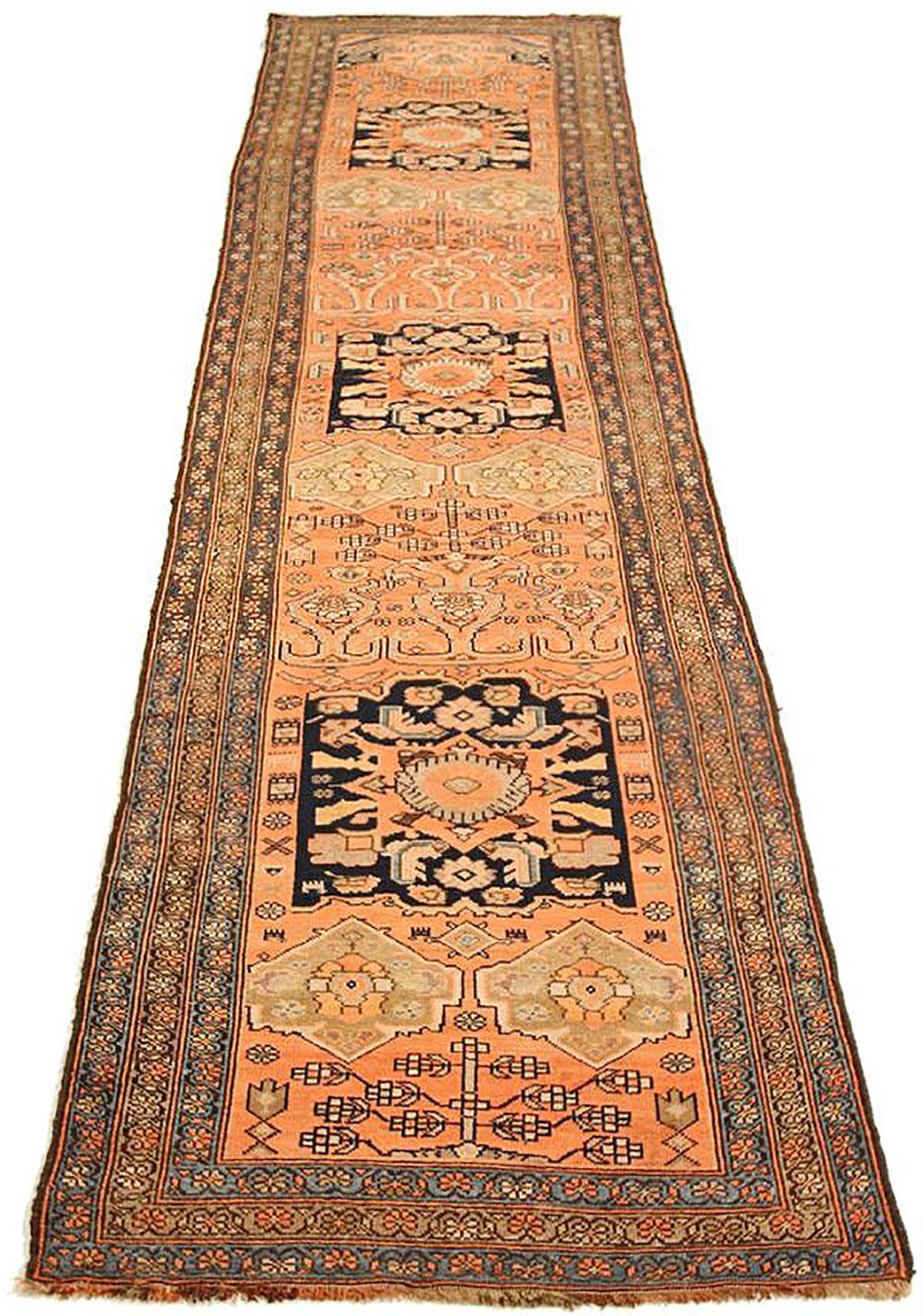 Antique Persian runner rug handwoven from the finest sheep’s wool and colored with all-natural vegetable dyes that are safe for humans and pets. It’s a traditional Malayer design featuring a beautiful combination of geometric details in black and