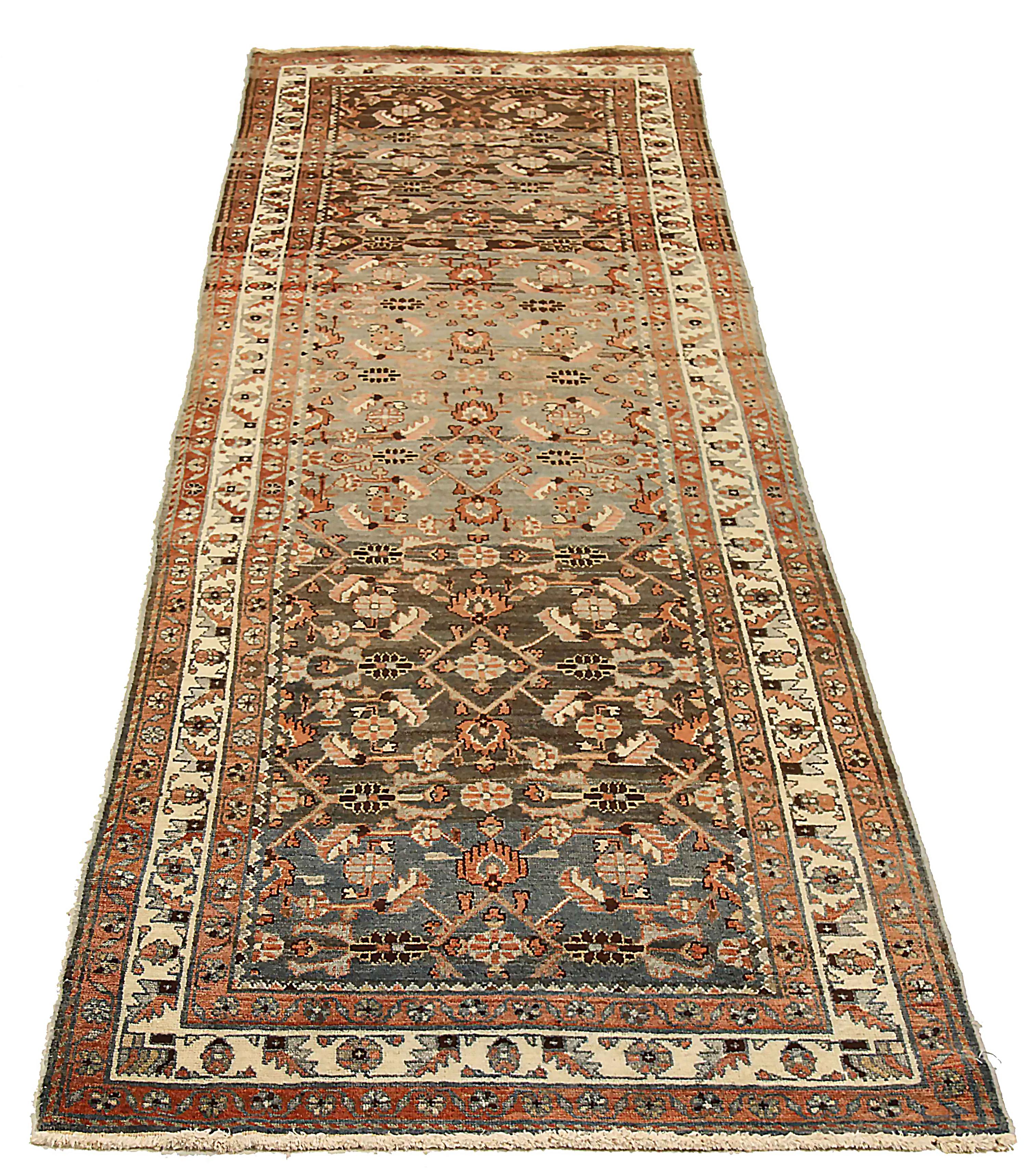 Antique Persian runner rug handwoven from the finest sheep’s wool. It’s colored with all-natural vegetable dyes that are safe for humans and pets. It’s a traditional Malayer design featuring a mix of botanical and tribal patterns. It’s a lovely