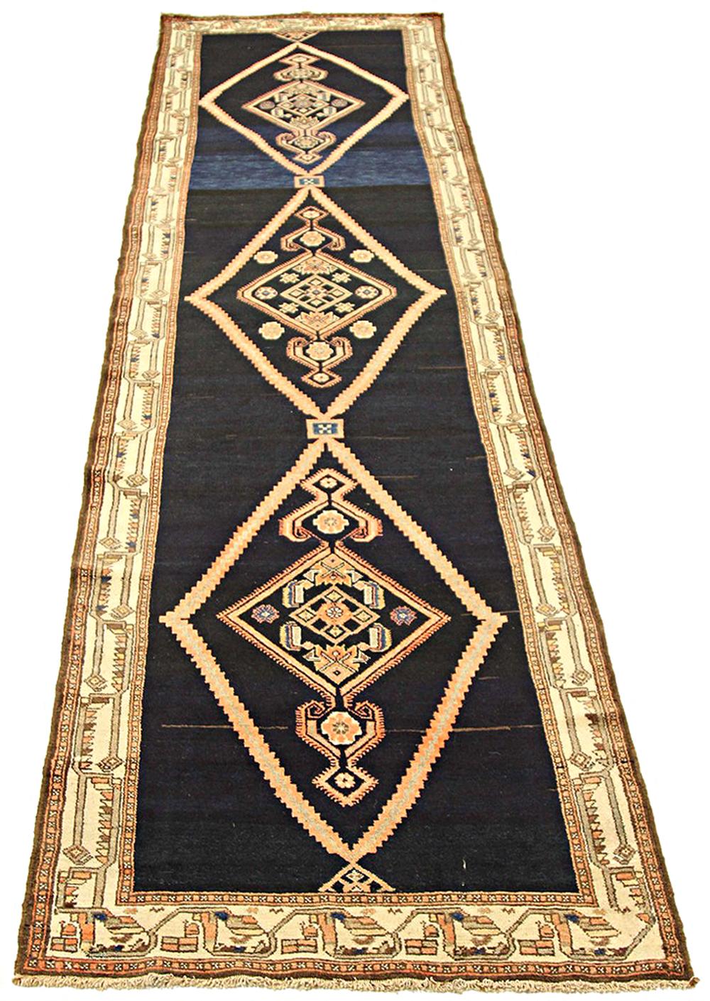 Antique Persian runner rug handwoven from the finest sheep’s wool and colored with all-natural vegetable dyes that are safe for humans and pets. It’s a traditional Malayer design featuring a beautiful combination of geometric details in gray and