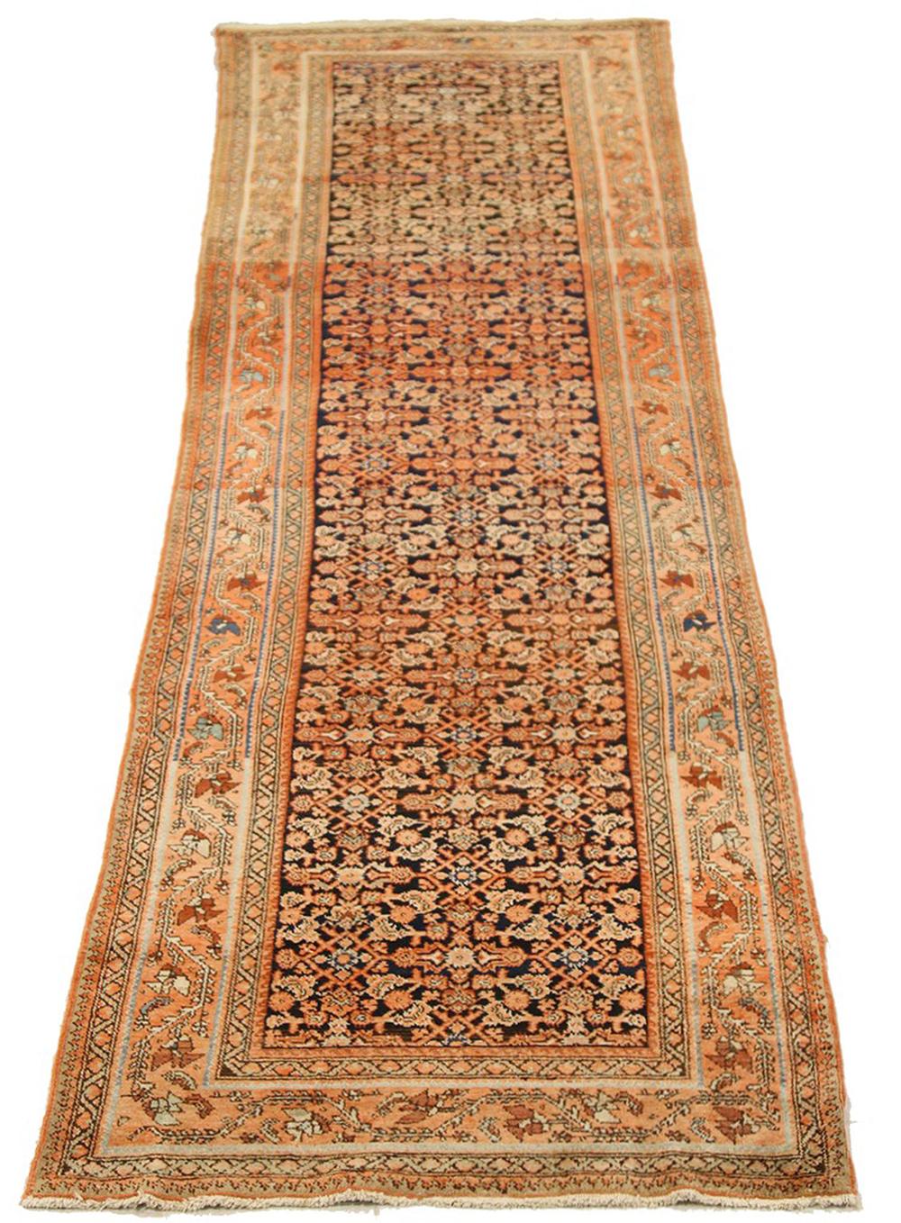 Antique Persian runner rug handwoven from the finest sheep’s wool and colored with all-natural vegetable dyes that are safe for humans and pets. It’s a traditional Malayer design featuring ivory and brown flower details over a beige and navy field.