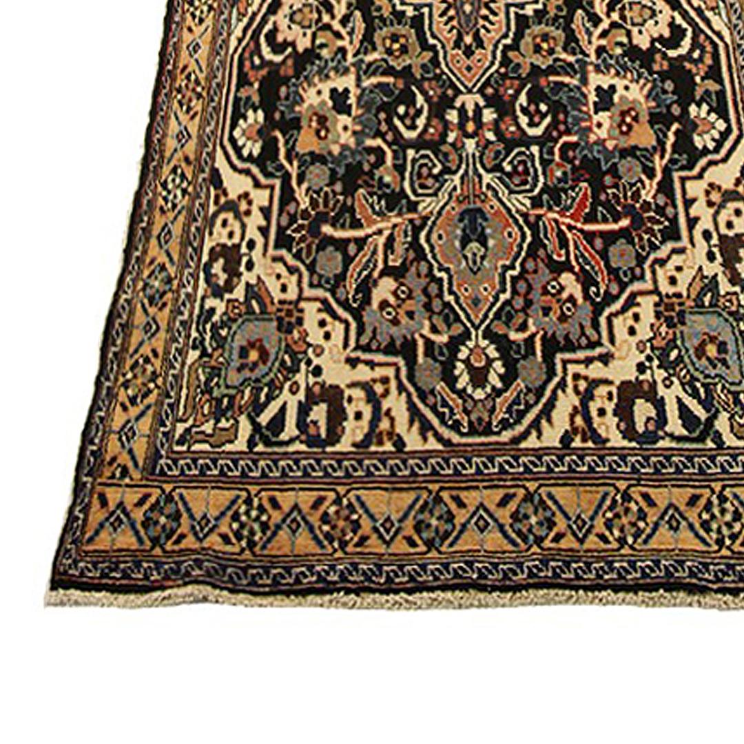 Antique Persian runner rug handwoven from the finest sheep’s wool and colored with all-natural vegetable dyes that are safe for humans and pets. It’s a traditional Malayer design featuring a series of floral details all-over in blue, red and black