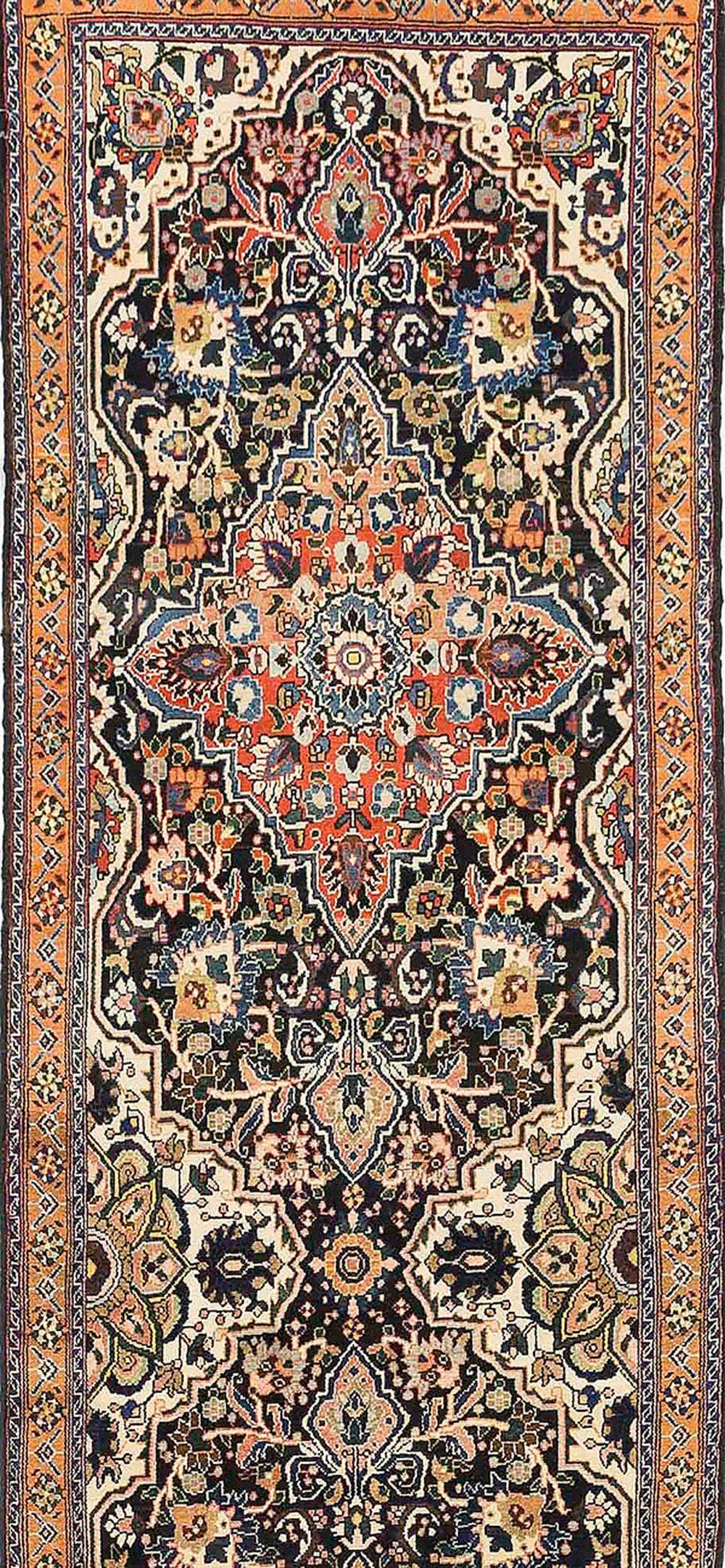 Mid-20th Century Antique Persian Malayer Runner Rug with Red and Blue Floral Details All-Over For Sale