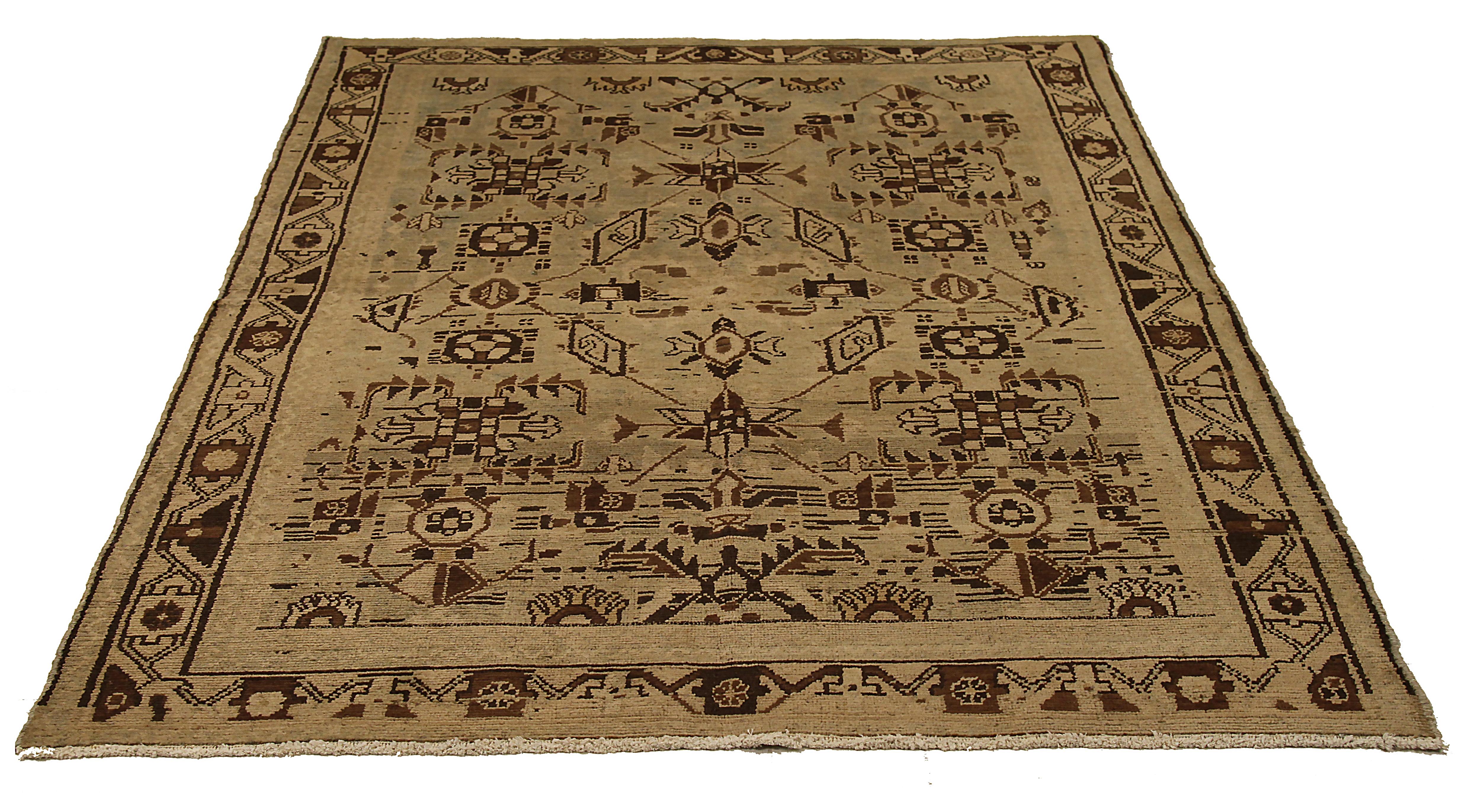 Antique Persian area rug handwoven from the finest sheep’s wool. It’s colored with all-natural vegetable dyes that are safe for humans and pets. It’s a traditional Malayer design featuring tribal design on a brown field. It’s a lovely piece to