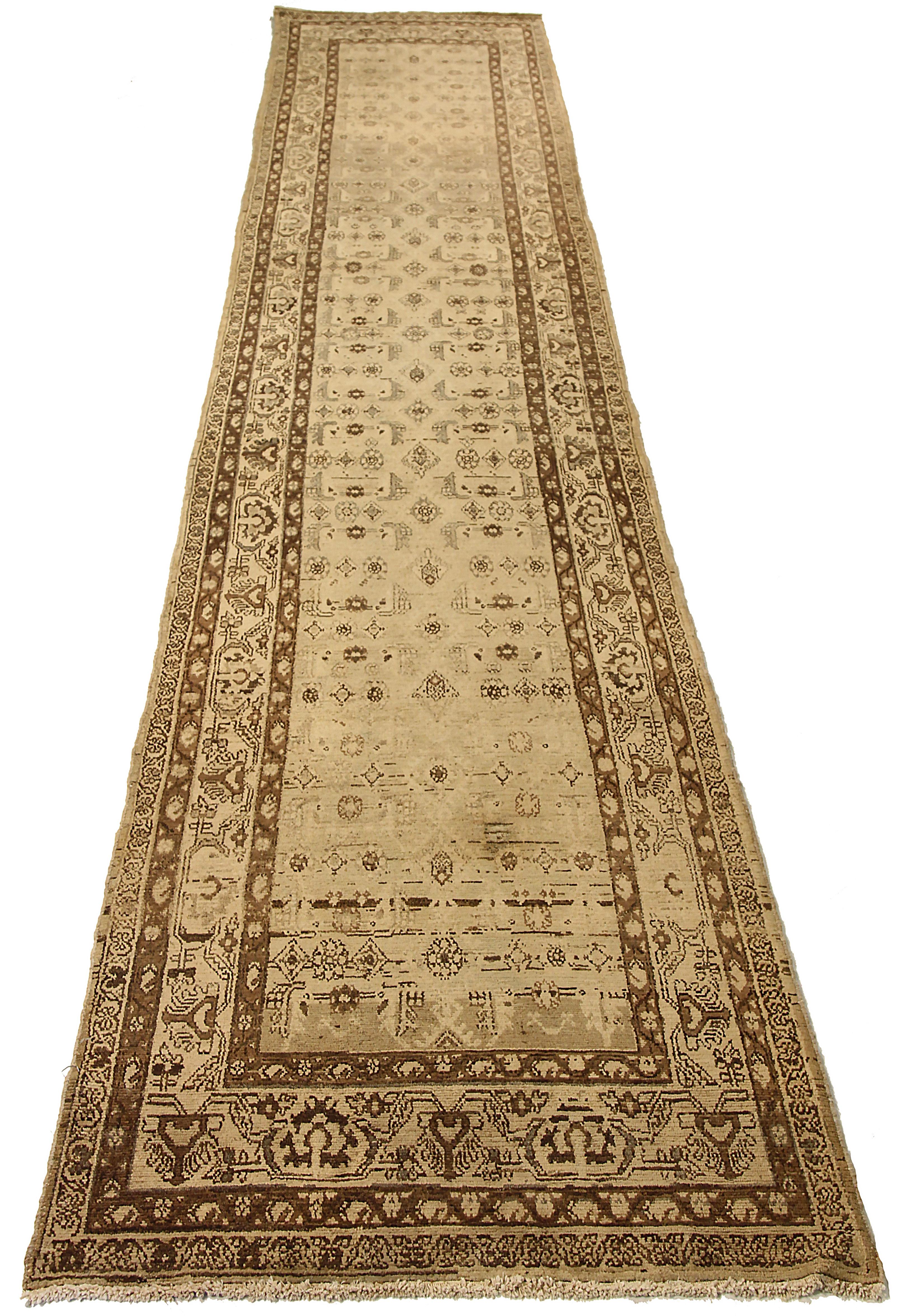 Antique Persian runner rug handwoven from the finest sheep’s wool. It’s colored with all-natural vegetable dyes that are safe for humans and pets. It’s a traditional Malayer design featuring tribal design on an ivory field. It’s a lovely piece to