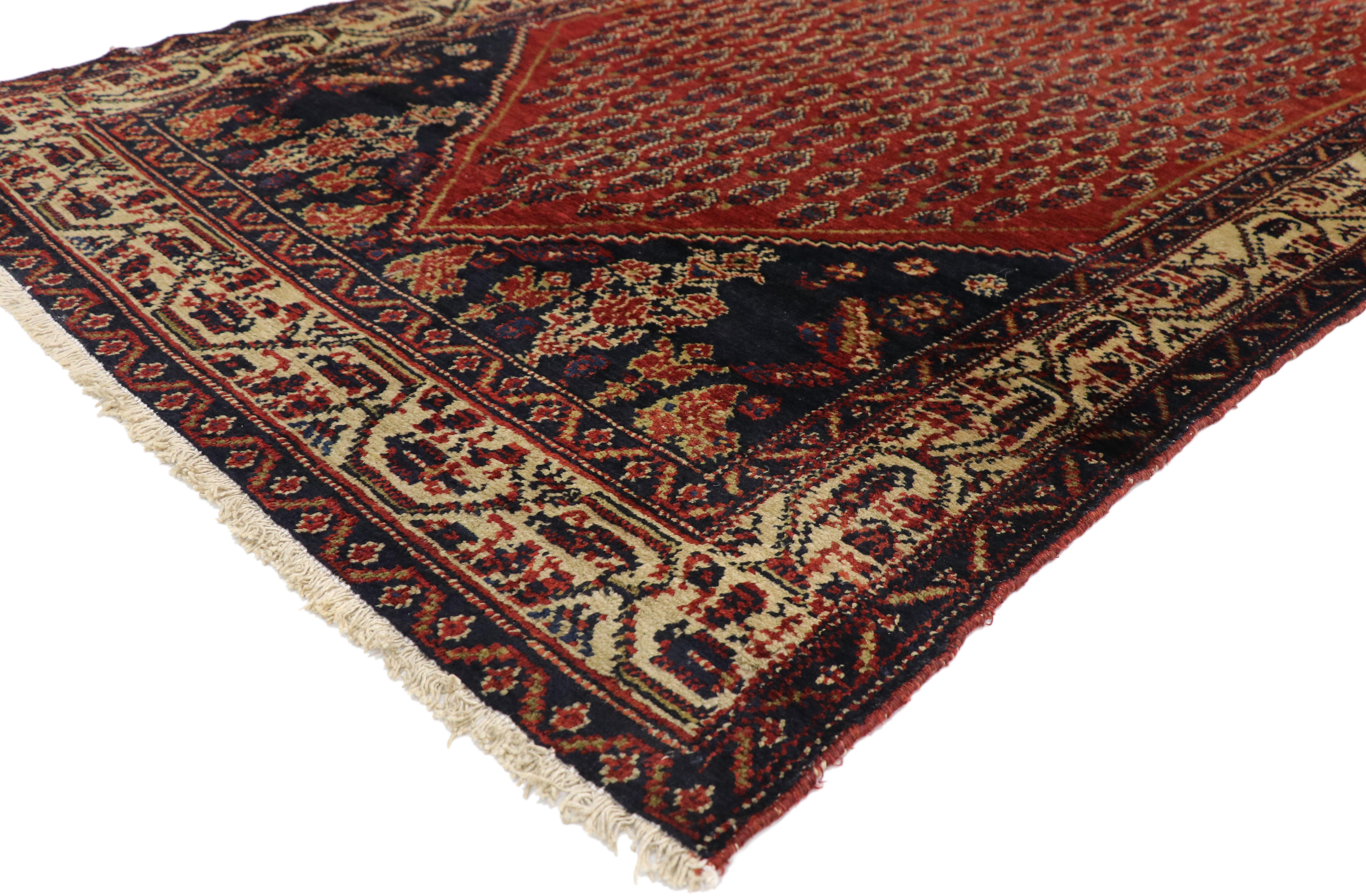 72241, antique Persian Malayer runner Victorian Manor House style. This hand knotted wool antique Persian Malayer runner features an all-over boteh pattern spread across an abrashed red field. The widely used boteh motif is thought to symbolize life
