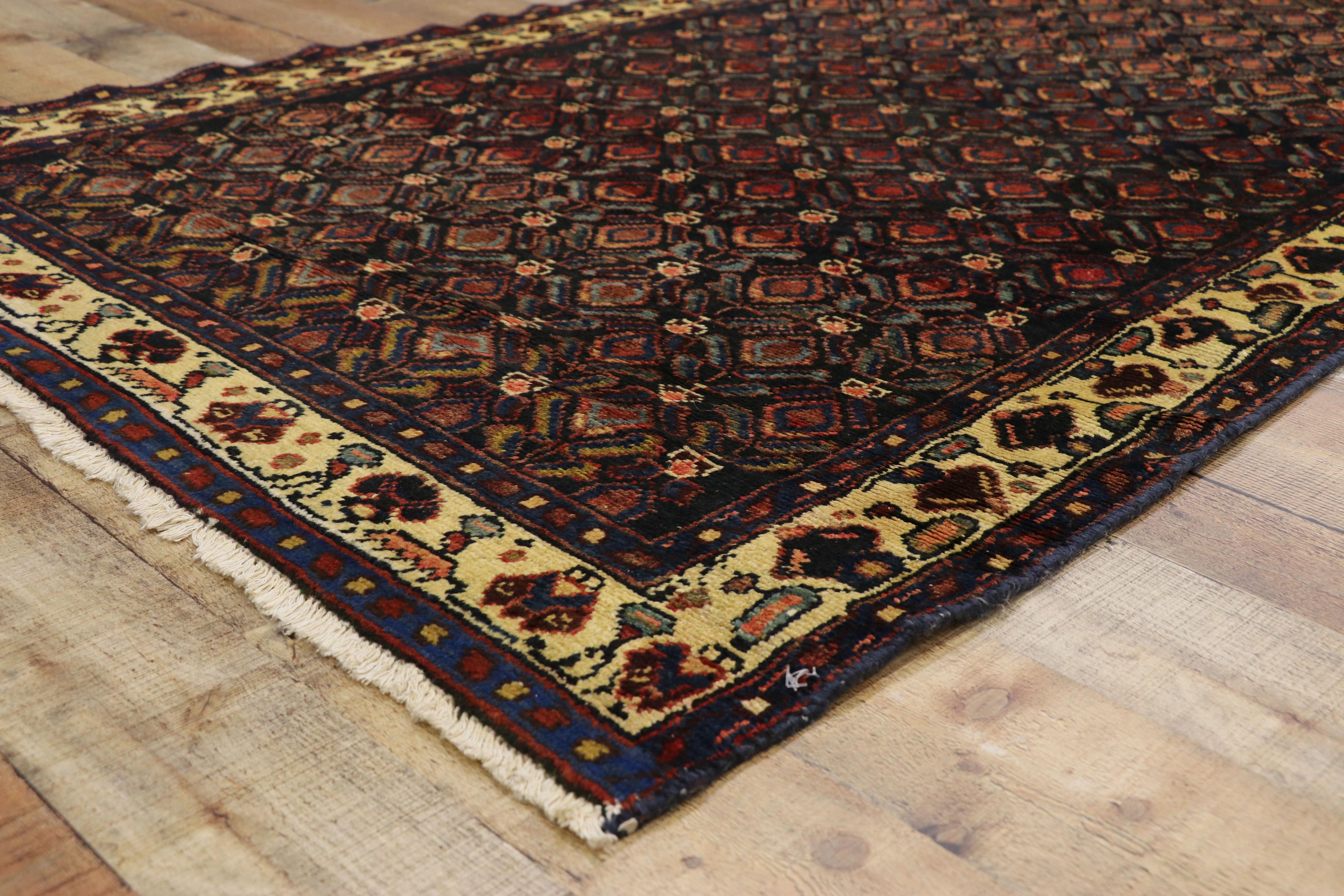 75367 antique Persian Malayer runner with aesthetic movement and Craftsman style. This hand knotted wool antique Persian Mahal runner displays an all-over repetitive pattern of opulent boteh motifs. The widely used boteh motif is thought to