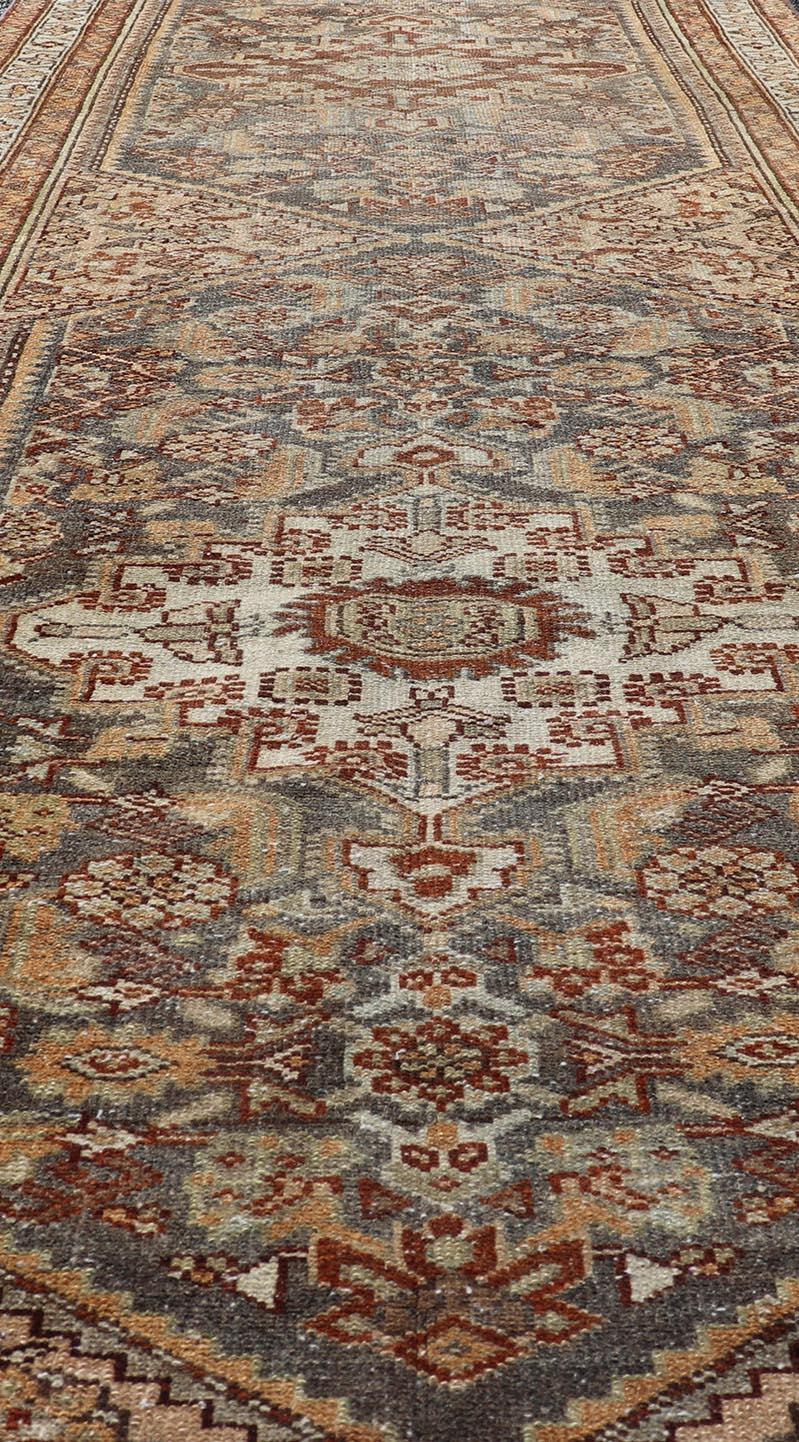 Wool Antique Persian Malayer Runner with All-Over Sub-Geometric Medallion Design For Sale