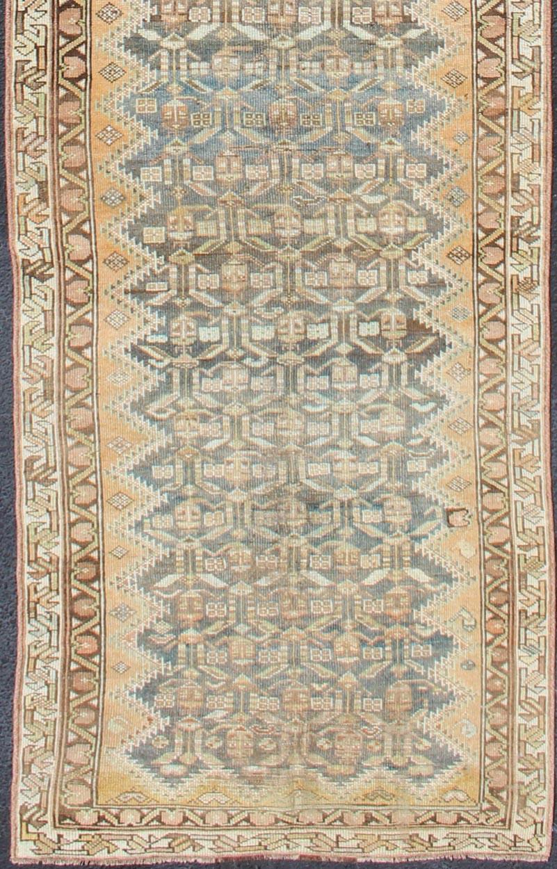 Malayer antique Runner from Persia with geometric design, rug SUS-1909-456, country of origin / type: Iran / Malayer, circa 1920.

This antique Malayer runner from 1920s Persia features a dynamic design and exciting color composition. The