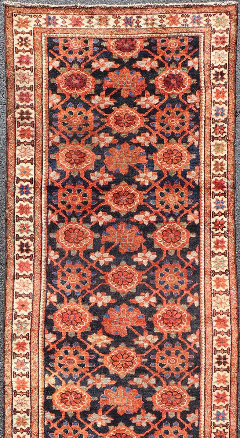 Antique Malayer runner from Persia with floral all-over design, Keivan Woven Arts / rug D-0510, country of origin / type: Iran / Malayer, circa 1920.

This antique Malayer runner from 1920s Persia features a dynamic design and exciting color