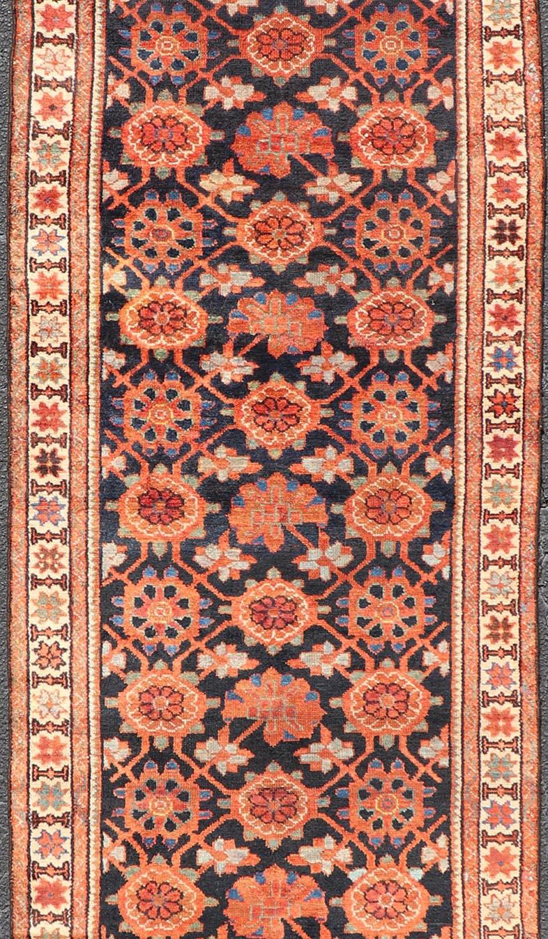 Hand-Knotted Antique Persian Malayer Runner with Reds and Oranges on a Charcoal Background For Sale