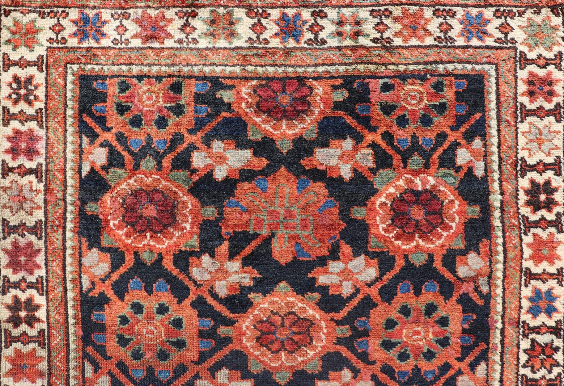 20th Century Antique Persian Malayer Runner with Reds and Oranges on a Charcoal Background For Sale