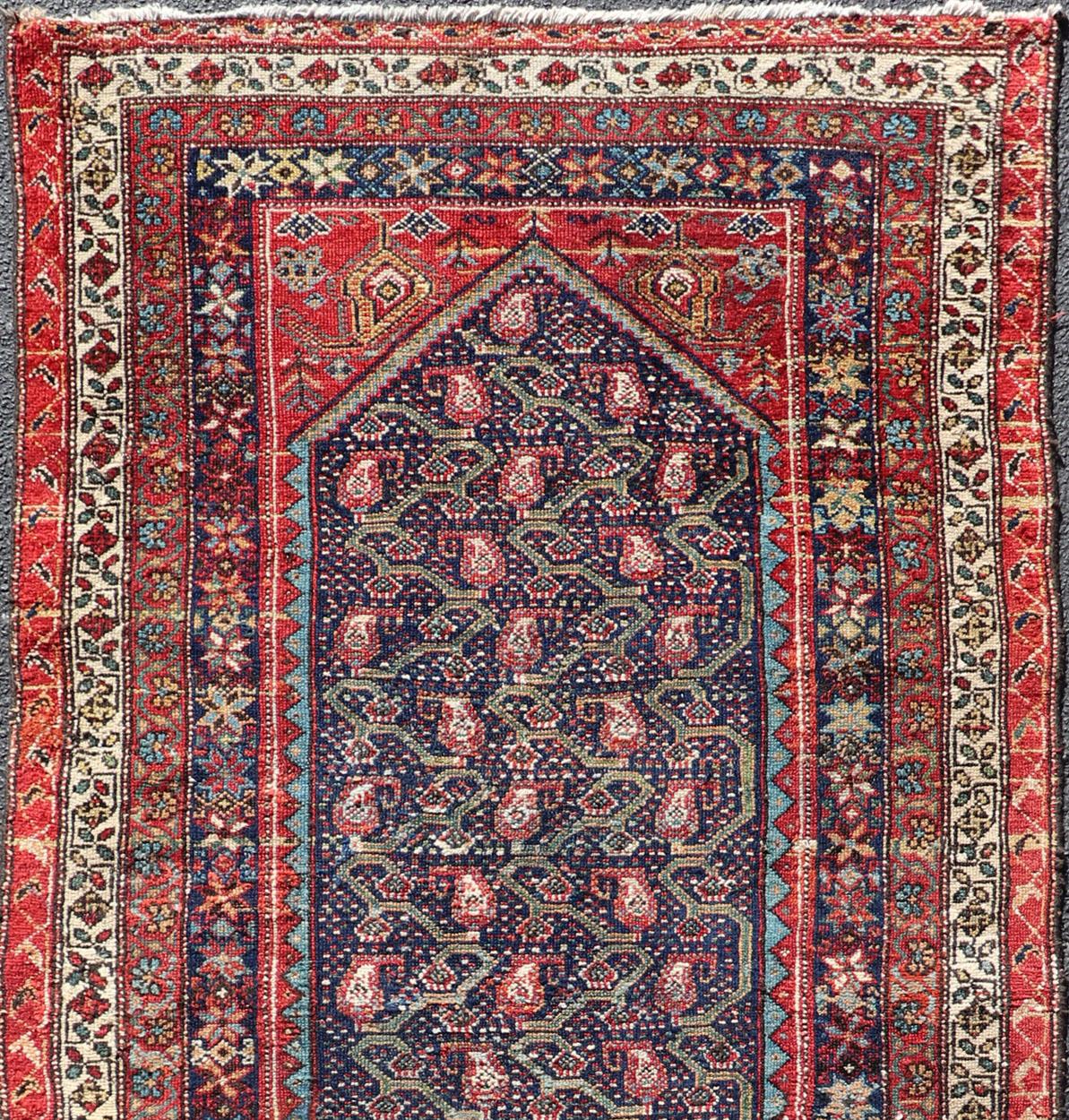 Variegated Border Malayer antique runner from Persia with geometric floral central field design, rug R20-1004, country of origin / type: Iran / Malayer, circa 1920.

This antique Persian Malayer runner, circa early 20th century, relies heavily on