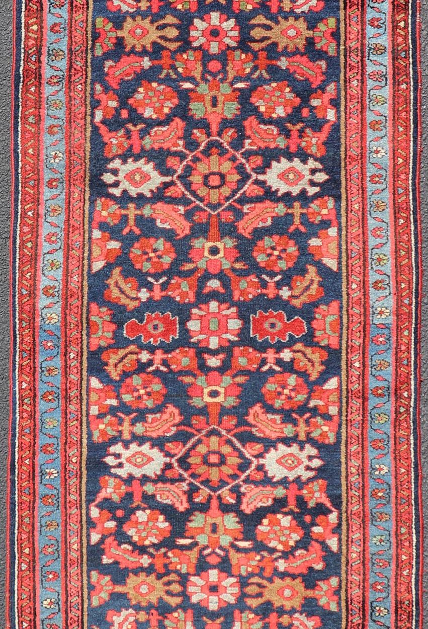 Malayer antique runner from Persia with geometric floral central field design, rug R20-1107, country of origin / type: Iran / Malayer, circa 1910.

Antique Persian Malayer runner with sub-geometric all-over design in navy background, light blue
