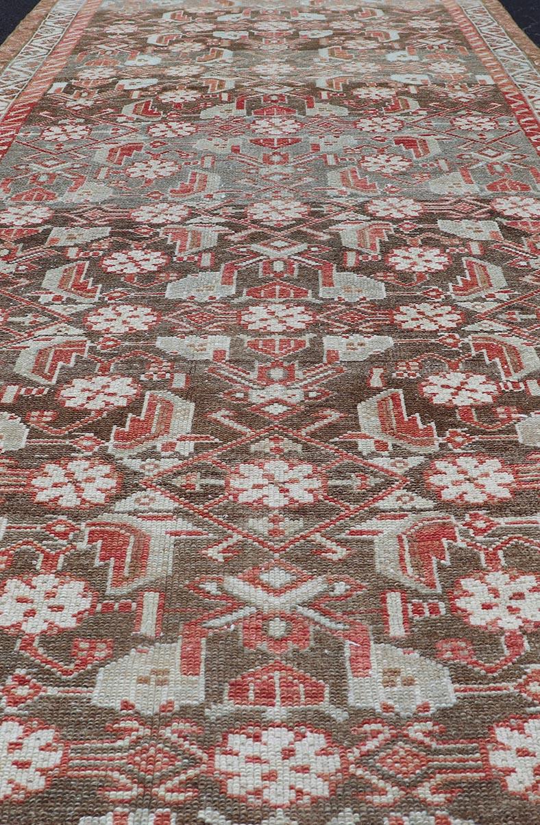 20th Century Antique Persian Malayer with Sub-Geometric Floral Design in Reds & Earthy Tones For Sale