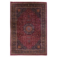 Antico tappeto persiano Mashad fatto a mano in lana rossa oversize con motivo a rosette