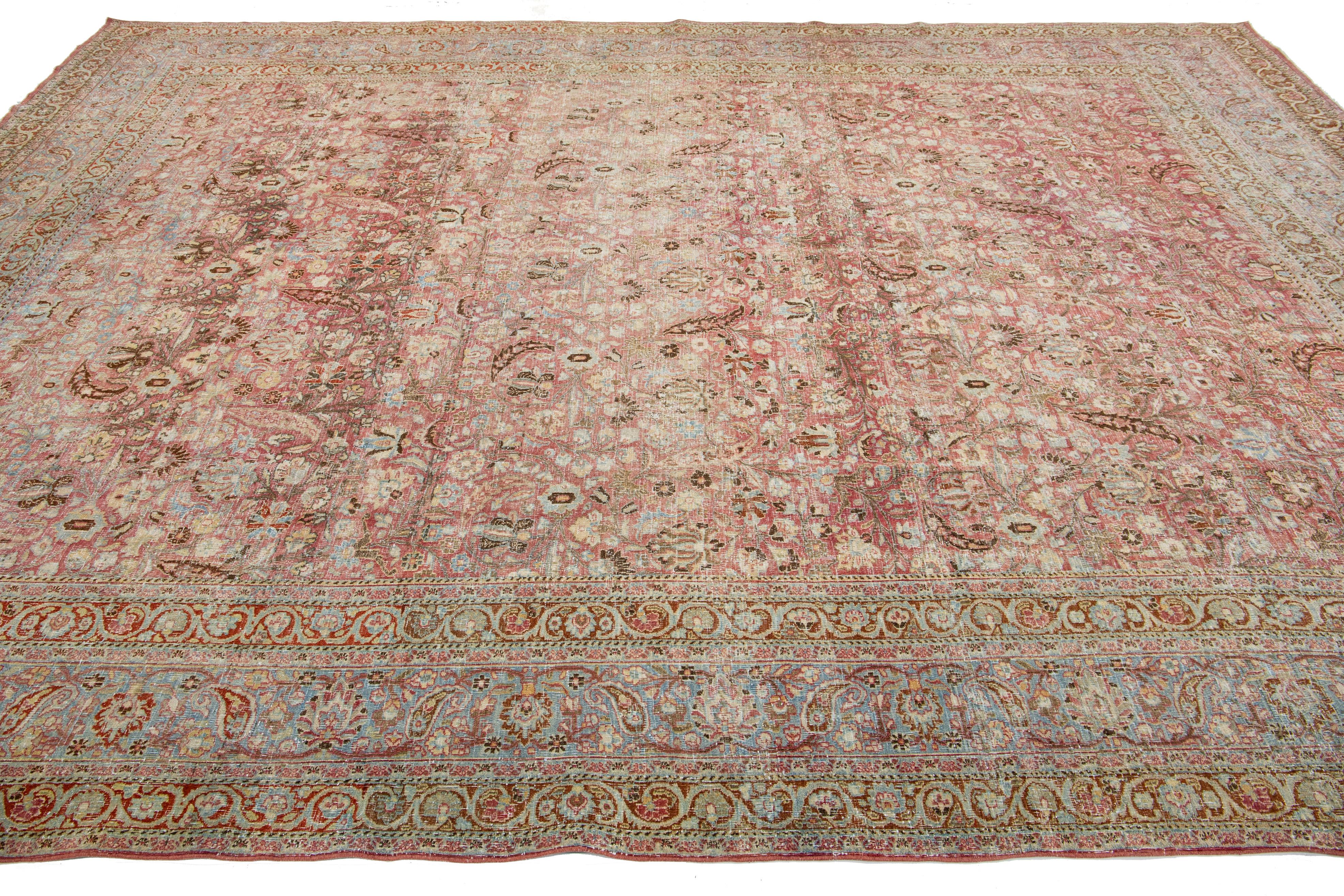 Hand-Knotted Antique Persian Mashad Handmade Red Wool Rug with Allover Floral Design For Sale