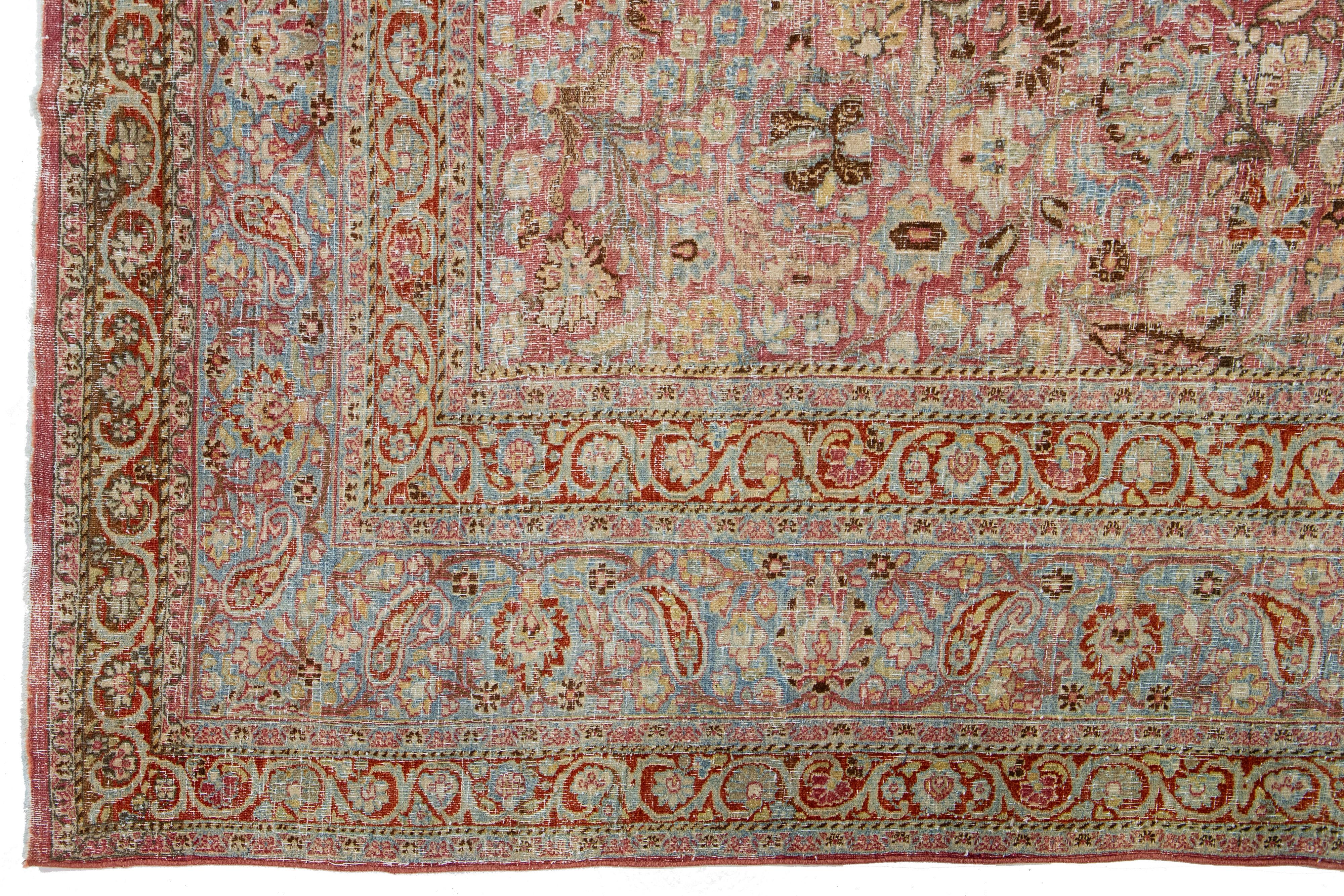 Antique Persian Mashad Handmade Red Wool Rug with Allover Floral Design In Good Condition For Sale In Norwalk, CT