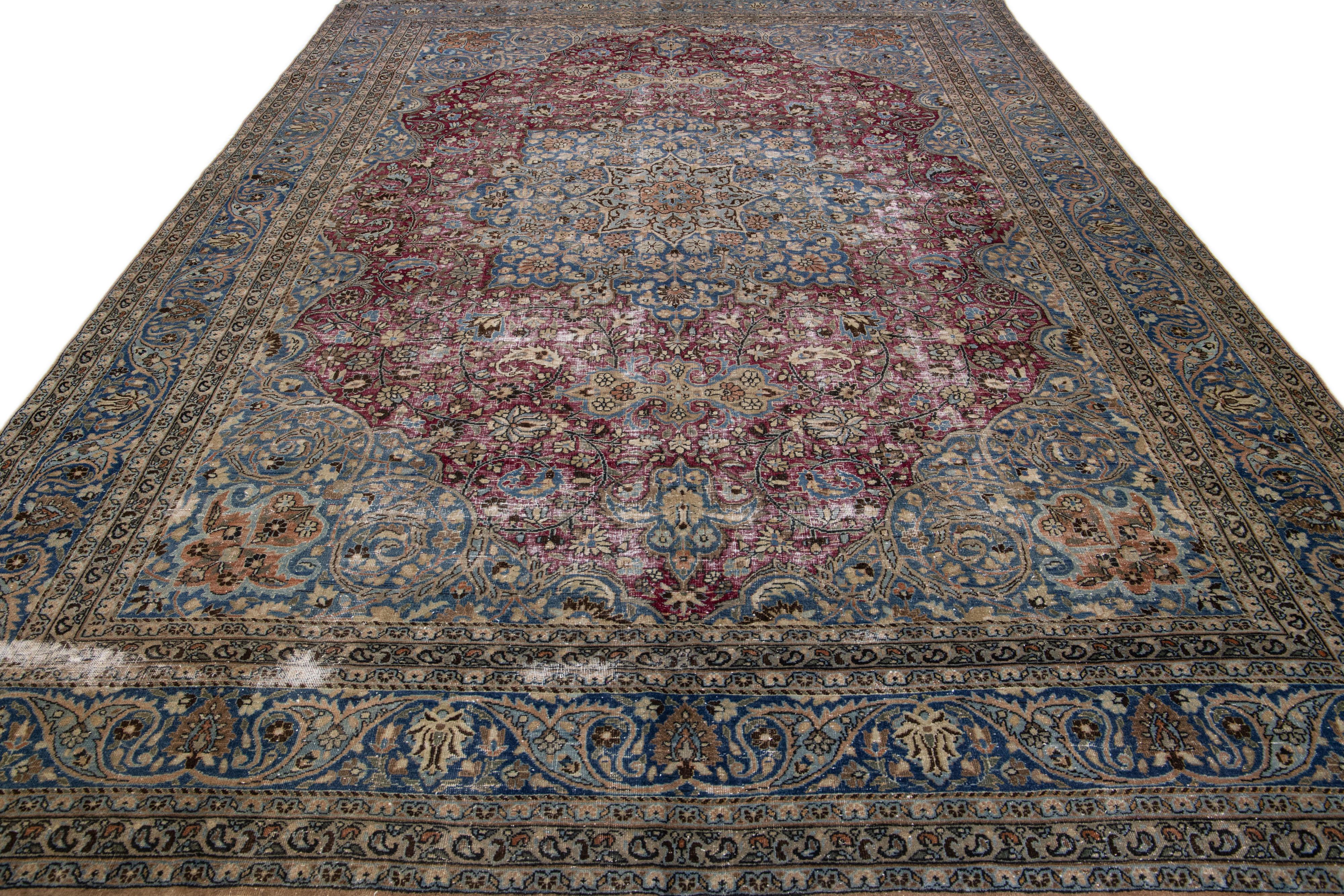 Islamic Antique Persian Mashad Red and Blue Handmade Wool Rug with Rosette Motif For Sale
