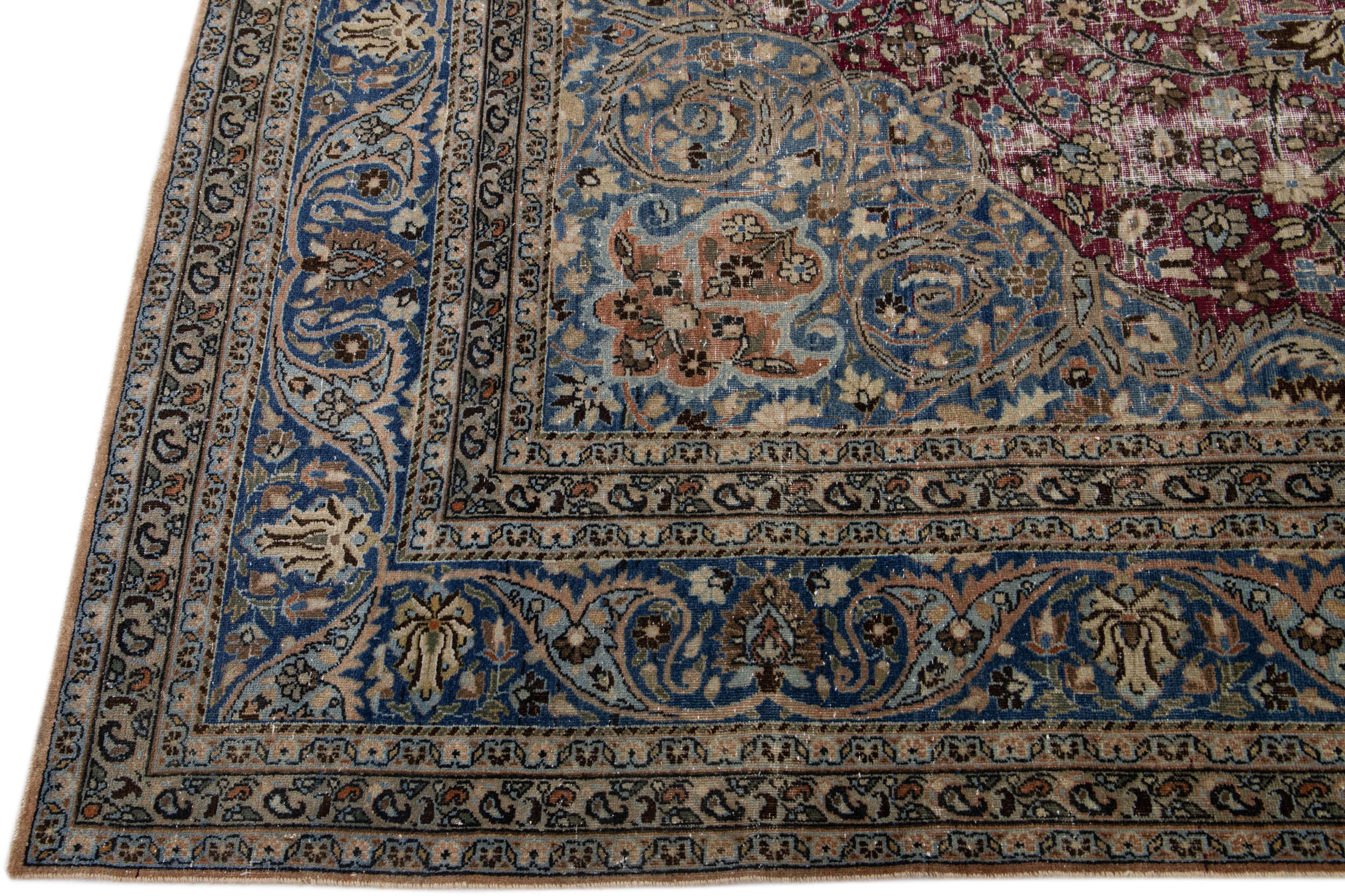 Hand-Knotted Antique Persian Mashad Red and Blue Handmade Wool Rug with Rosette Motif For Sale