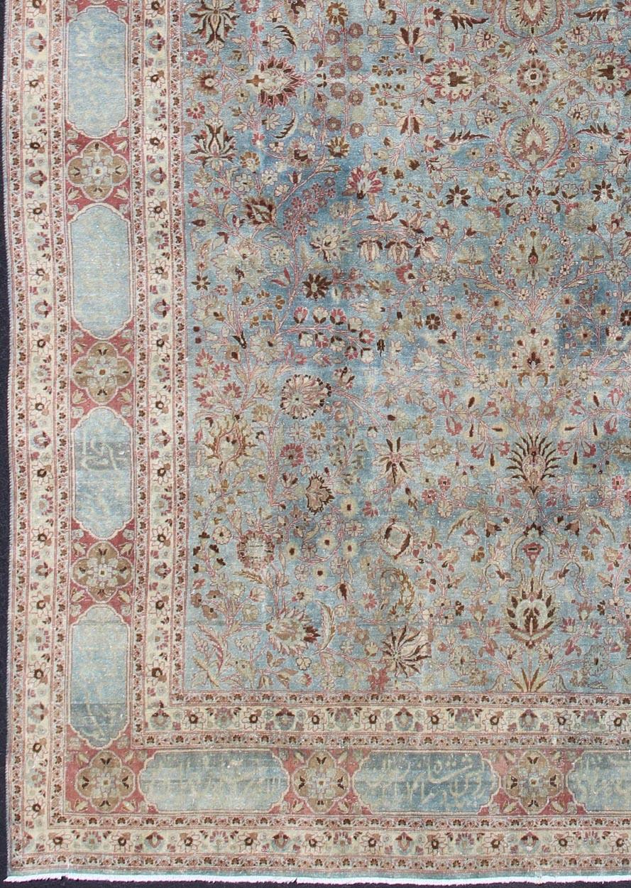 Antique large Persian Mashhad rug with inscriptions in light blue background, rose border. Keivan Woven Arts / rug 18-0807, country of origin / type: Iran / Mashhad, circa 1920.

Measures: 11'8 x 17'6.

Mashhad is a major city in the north eastern