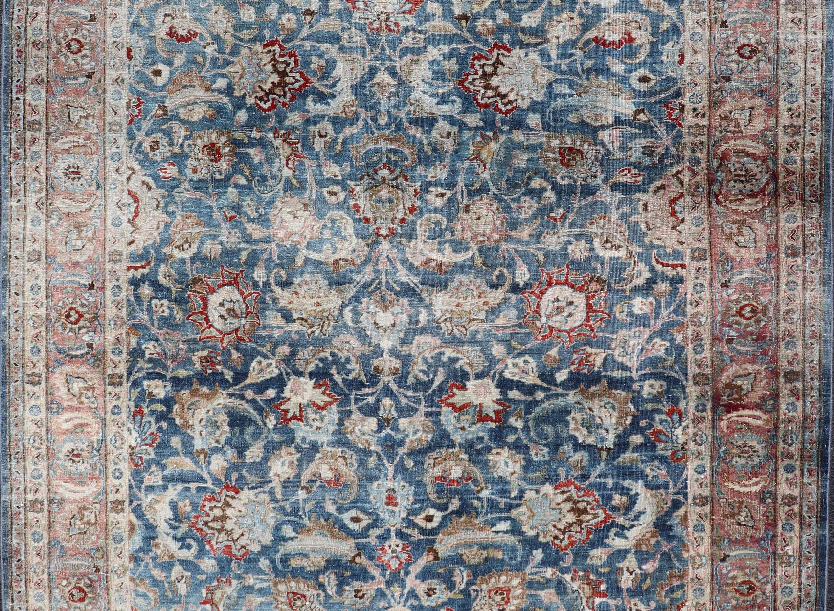 Hand-Knotted Antique Persian Mashad with Medium in Boteh Blue Background, Salmon Border For Sale