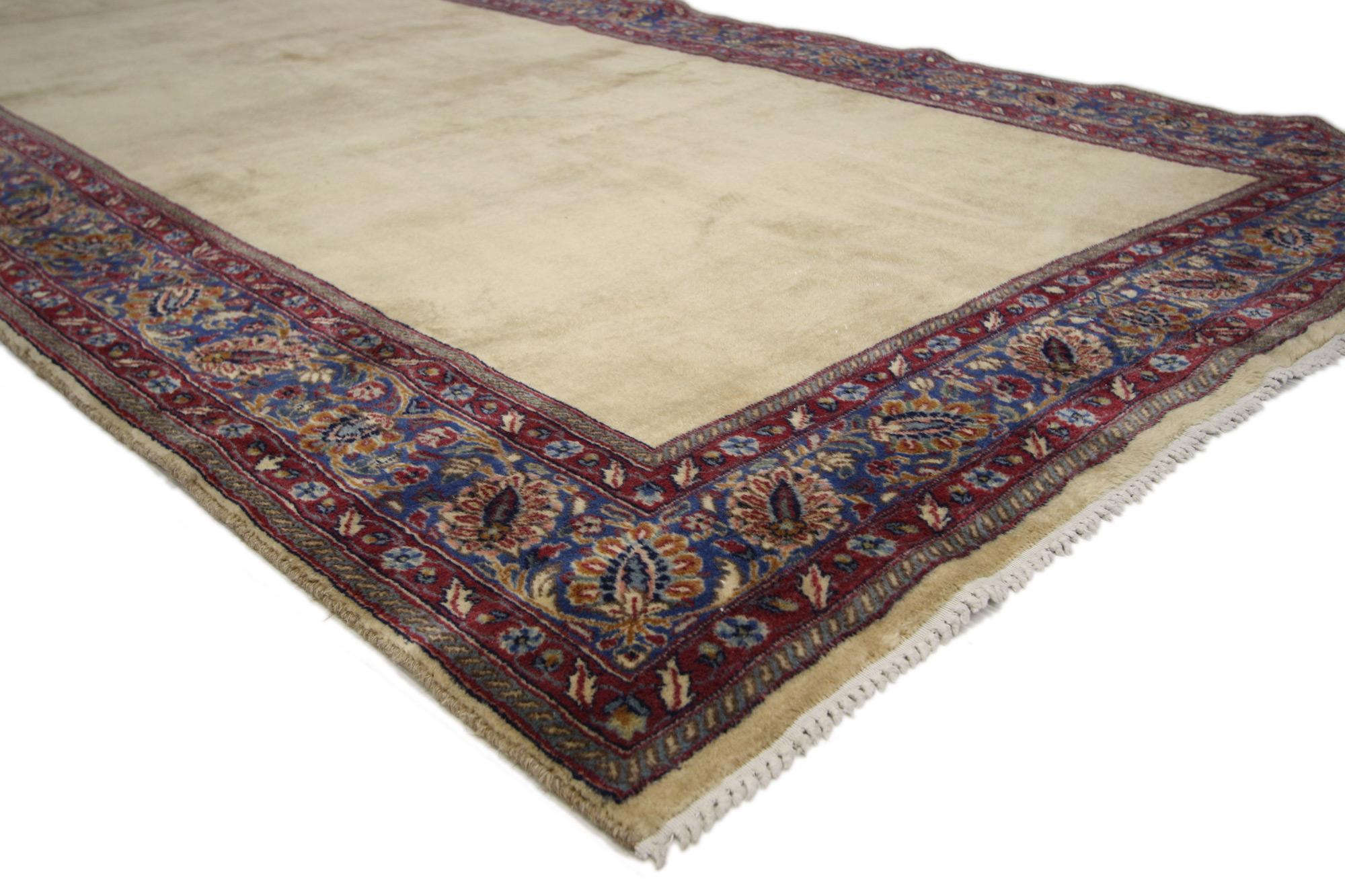 60735 Antique Persian Mashhad Gallery Rug, 05'00 x 21'09.
Emulating timeless style with incredible detail and texture, this antique Persian Mashhad rug is a captivating vision of woven beauty. The open coveted field and earthy colorway woven into